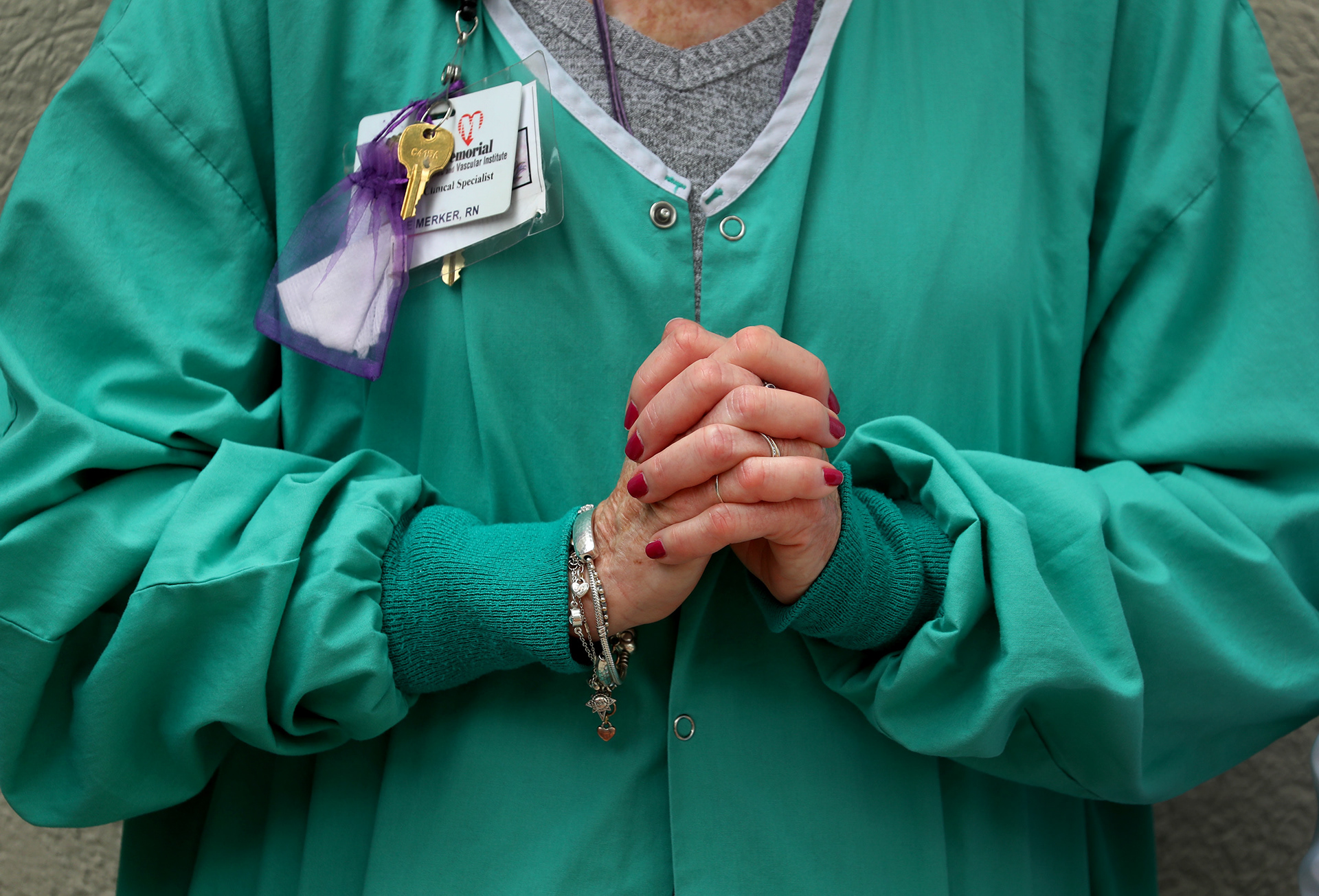 A Memorial Regional Hospital nurse prays during a remembrance service for George Floyd on June 8, 2020 in Hollywood, Fl.  Healthcare workers at all six of Memorial's hospitals simultaneously participated in the prayer vigil led by area clergy to inspire peace and unity during a time of social unrest.