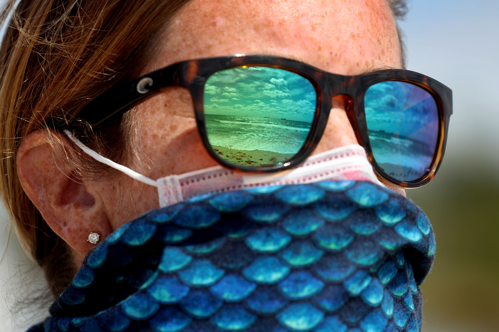 Fort Lauderdale Ocean Rescue Chief Alex O'Connor looks out onto an empty beach temporarily closed at the onset of the COVID-19 pandemic in 2020.