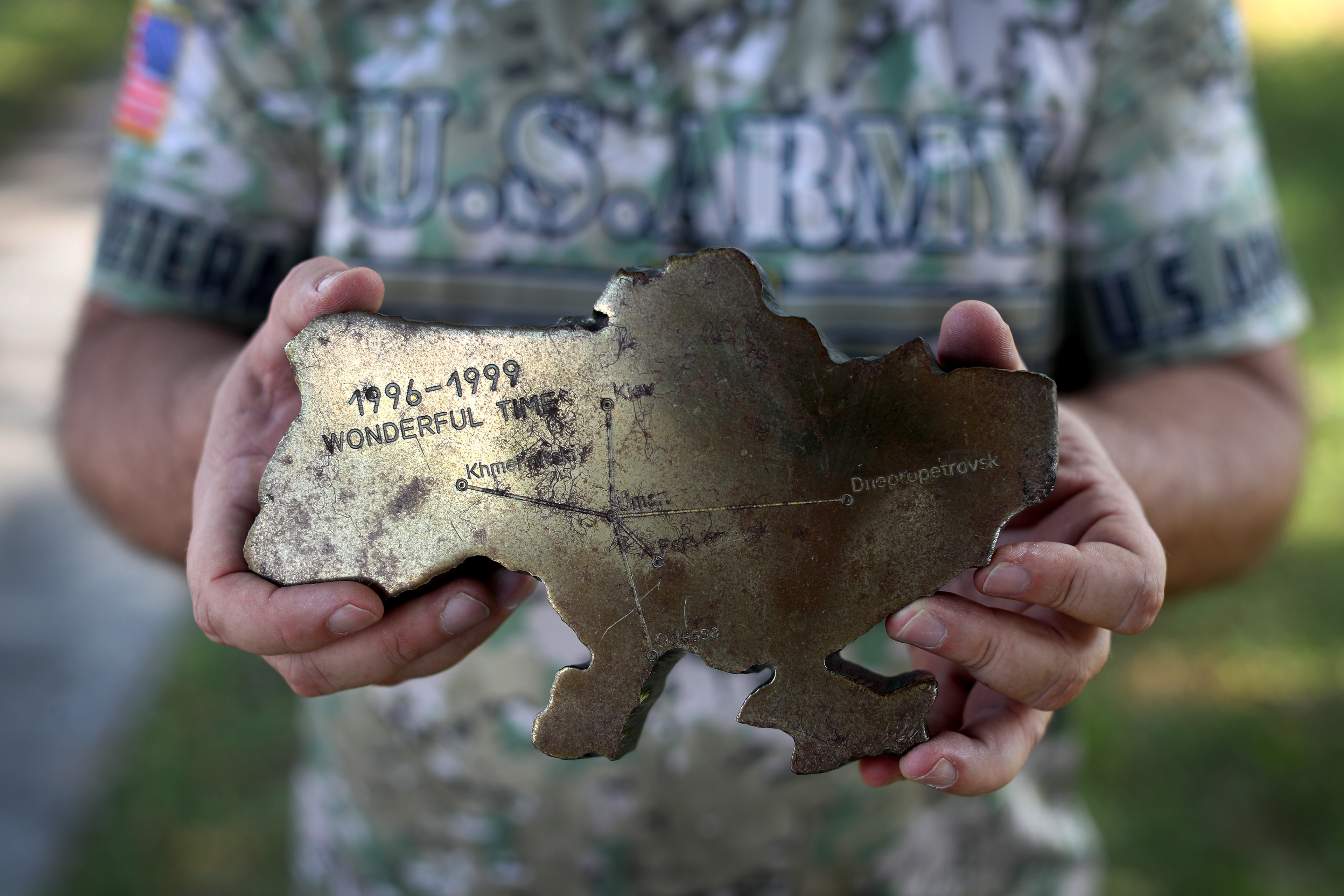 Retired Army Col. Bill Millard holds a chunk of metal in the shape of Ukraine that was made from a piece of a nuclear bomb silo that he helped dismantle in the 1990's. Millard now hosts an annual fundraiser in Boca Raton, Fl. to help the people of Ukraine.