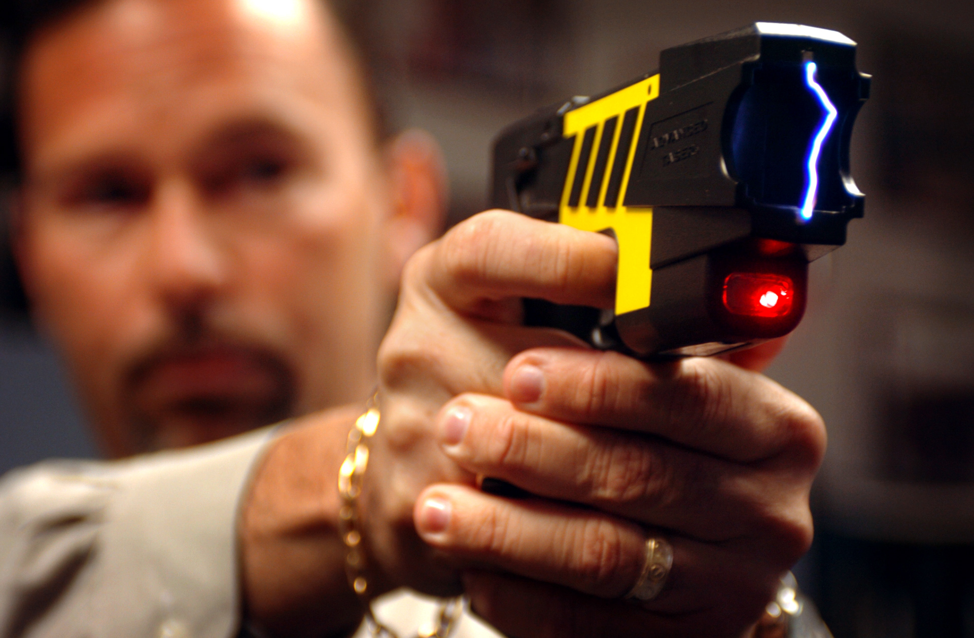 A city of Hollywood police officer demonstrates a taser gun