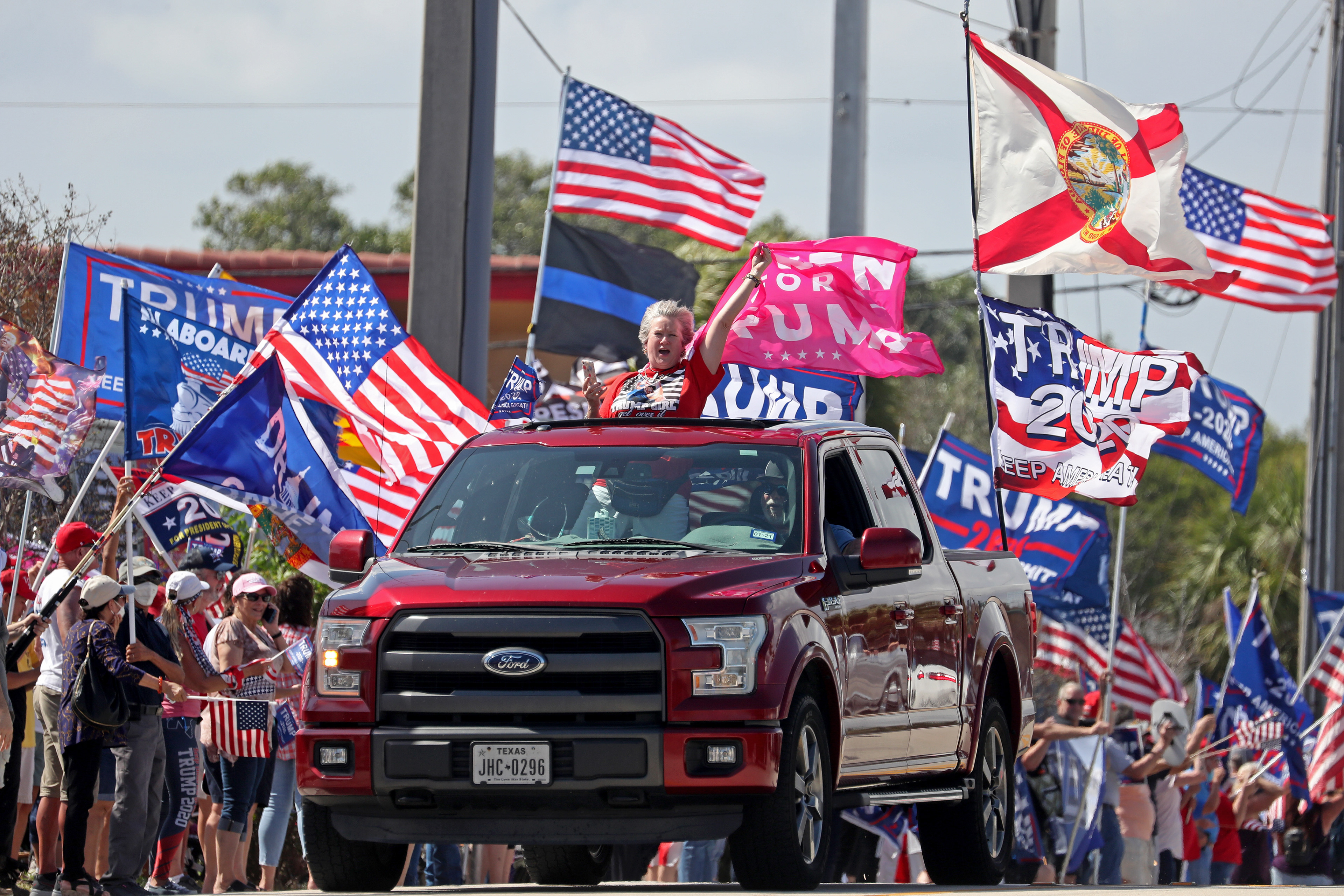 Trump supporters participate in a President's Day pro Trump rally in West Palm Beach, Fl. in 2021 where the former President drove by and waved to the cheering crowd.