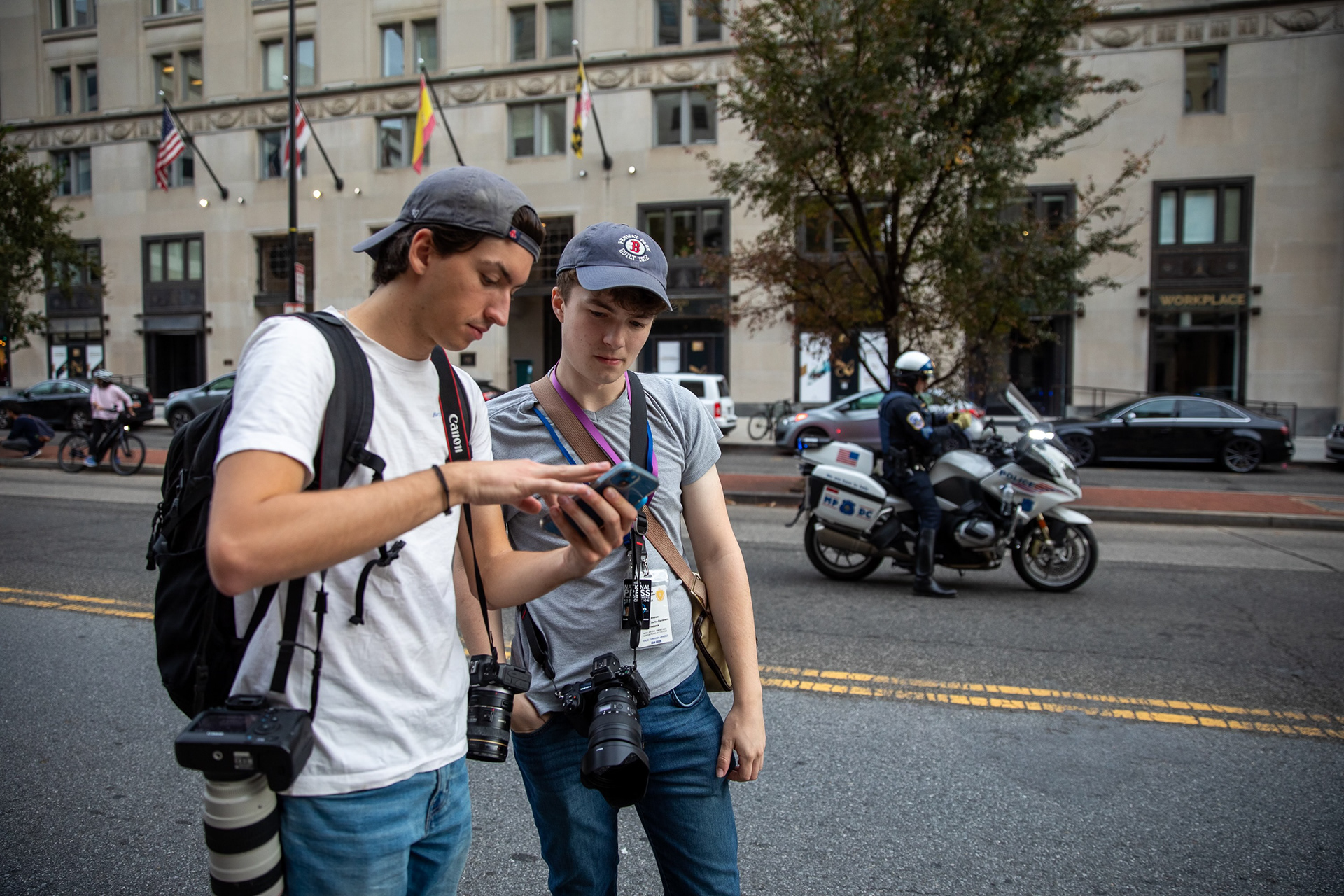 Matthew and Andrew Burke-Stevenson in Washington while photographing a mass protest. Photo by Taylor Coester.