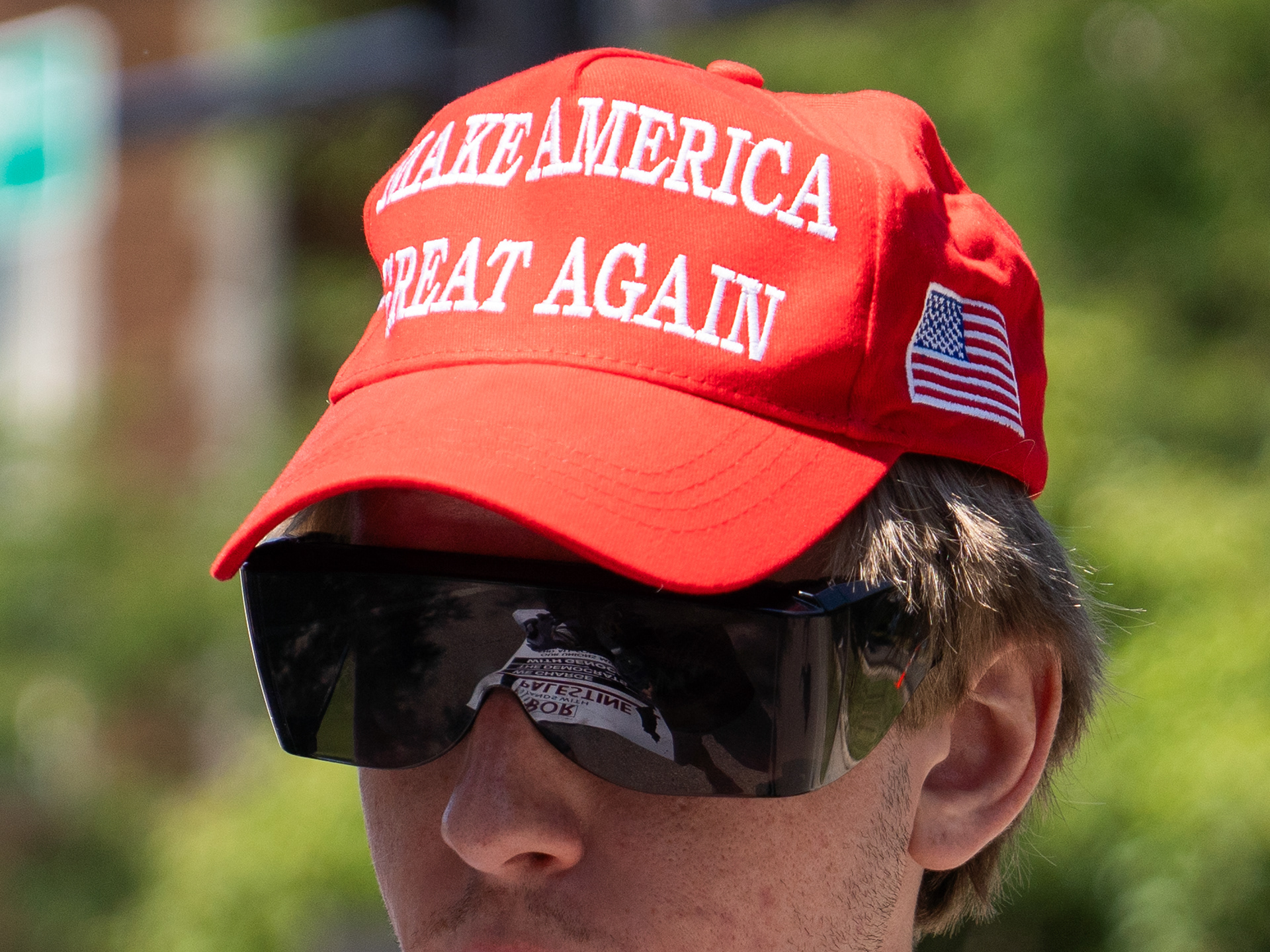 Chicago — A Trump supporter sports a red MAGA hat during the DNC in Chicago on Aug. 19, 2024. 