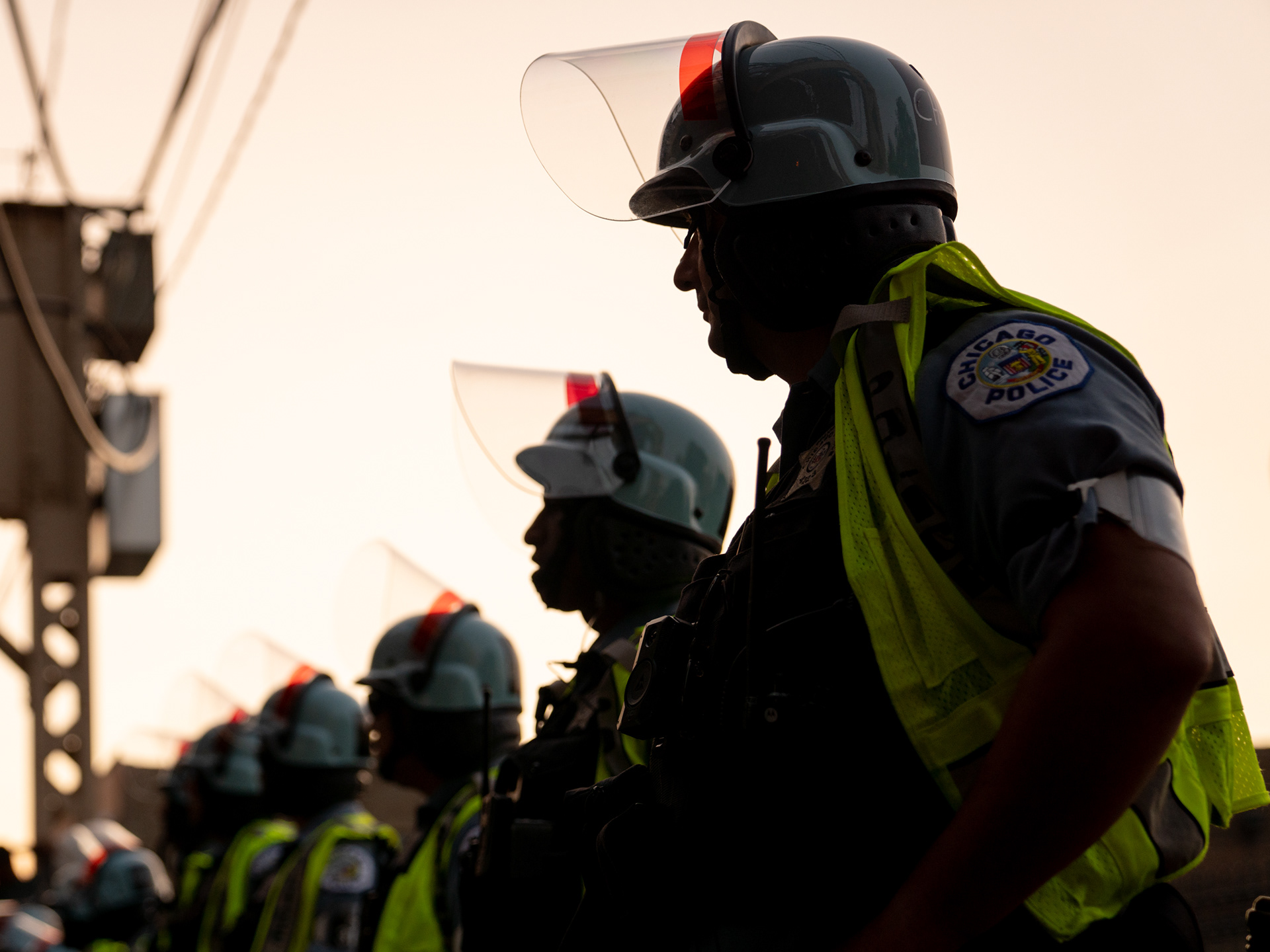 Chicago — Police officers in riot helmets awaiting protesters during a march on the DNC. Aug. 21, 2024.