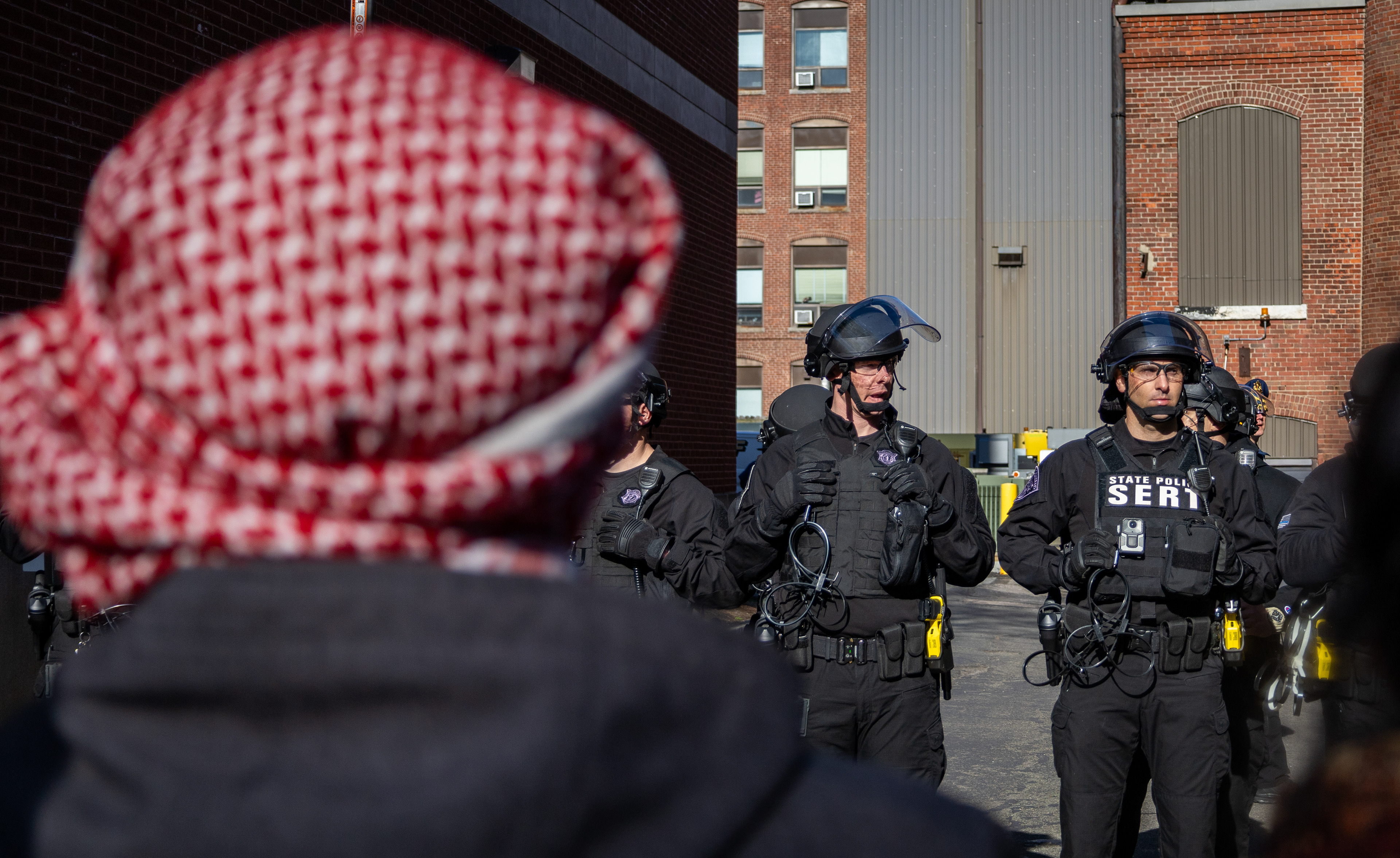 Boston — Massachusetts state police SERT unit stands guard against protesters at Northeastern University in Boston.