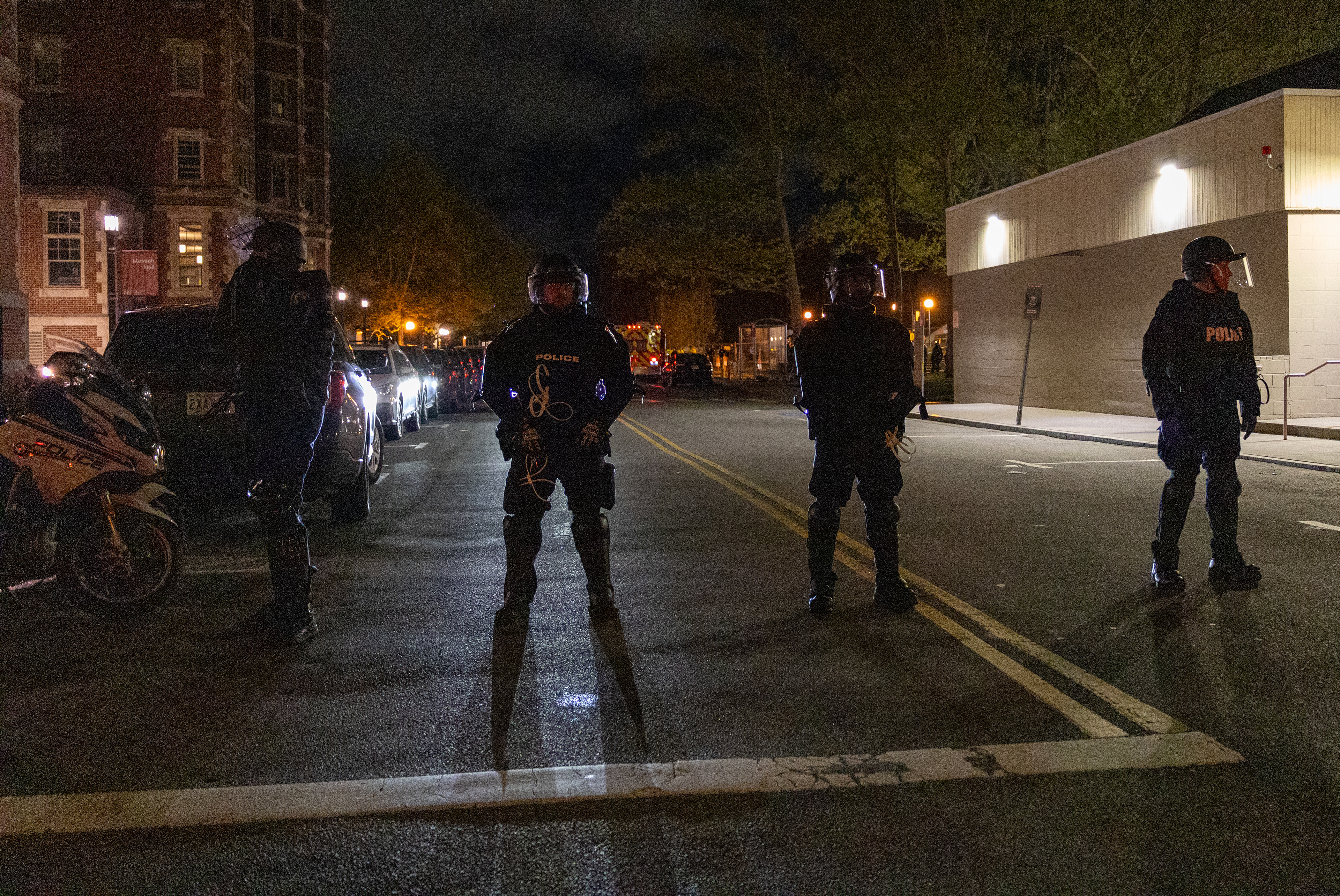 Cambridge, Mass. — Boston SWAT police stand guard as M.I.T. police clear out an encampment on the campus before 5 a.m. in Cambridge.