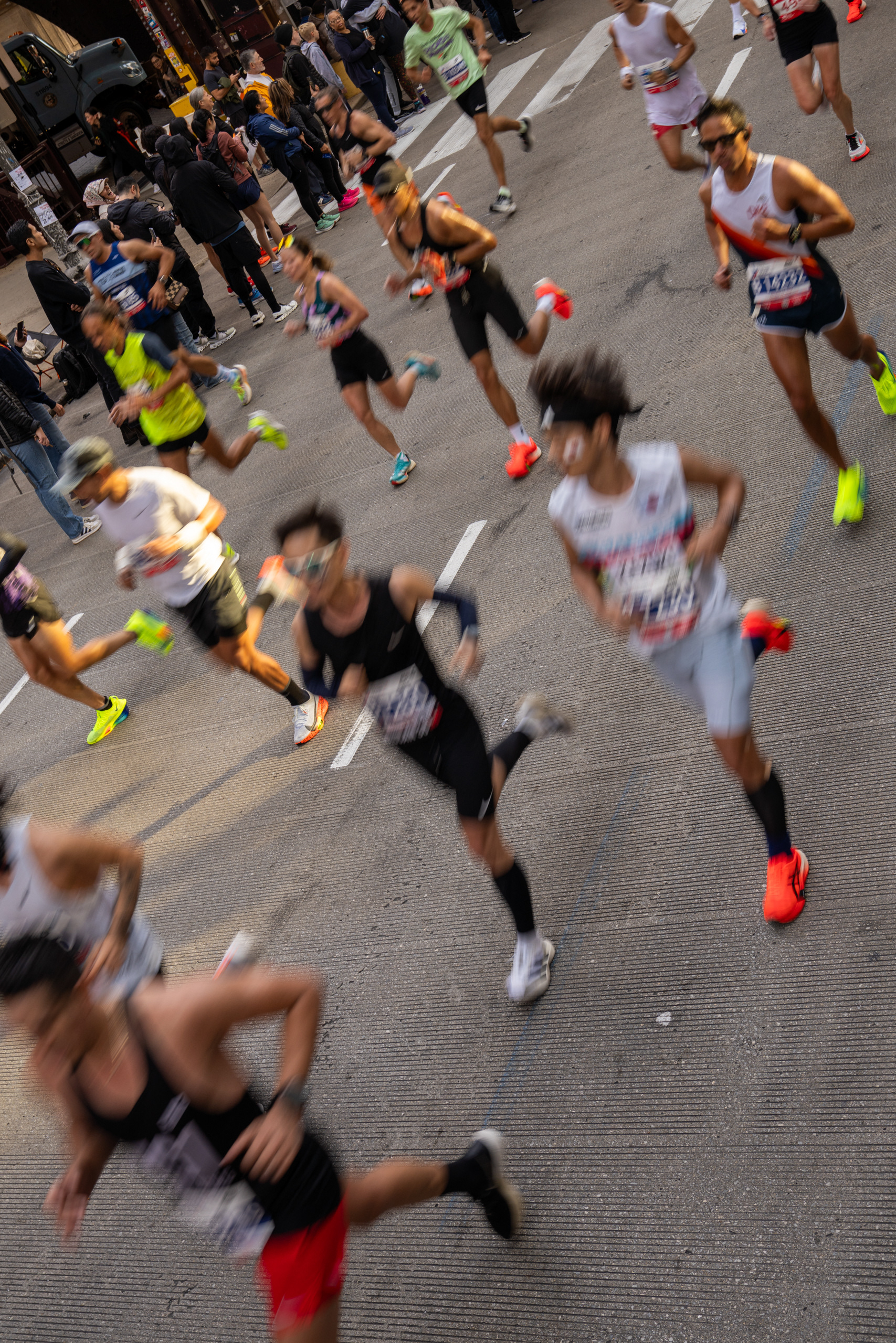 Runners fly by in the Chicago Marathon. Oct. 13, 2024.