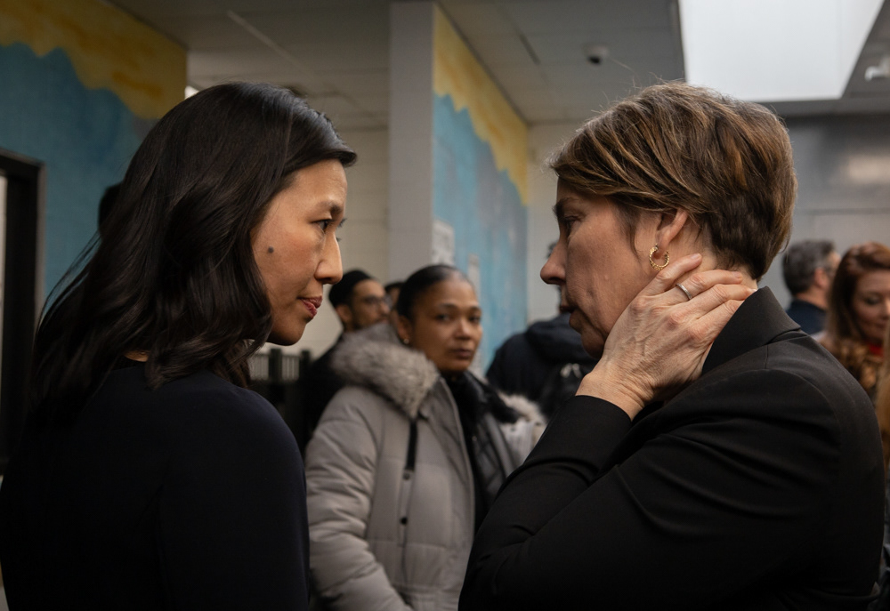 Boston — Boston mayor Michelle Wu (left) speaks with Massachusetts governor Maura Healey (right) at Melana Cass Recreation Center after announcing the center will be a new migrant center for hundreds of migrants in Boston, Feb. 1, 2024