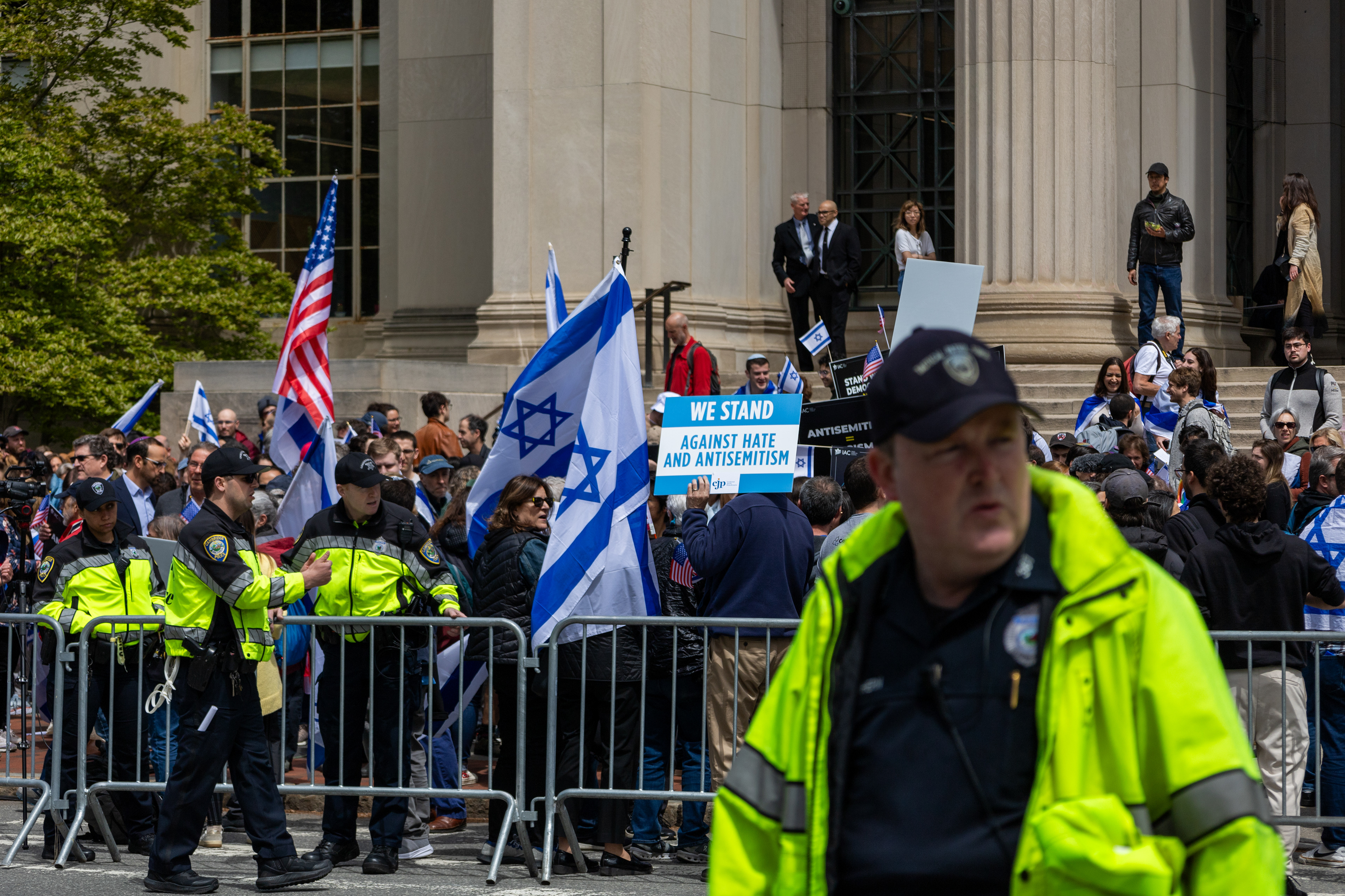 Cambridge, Mass. — A police officer watches as Israeli counter protesters confront pro-Palestine protesters at M.I.T.