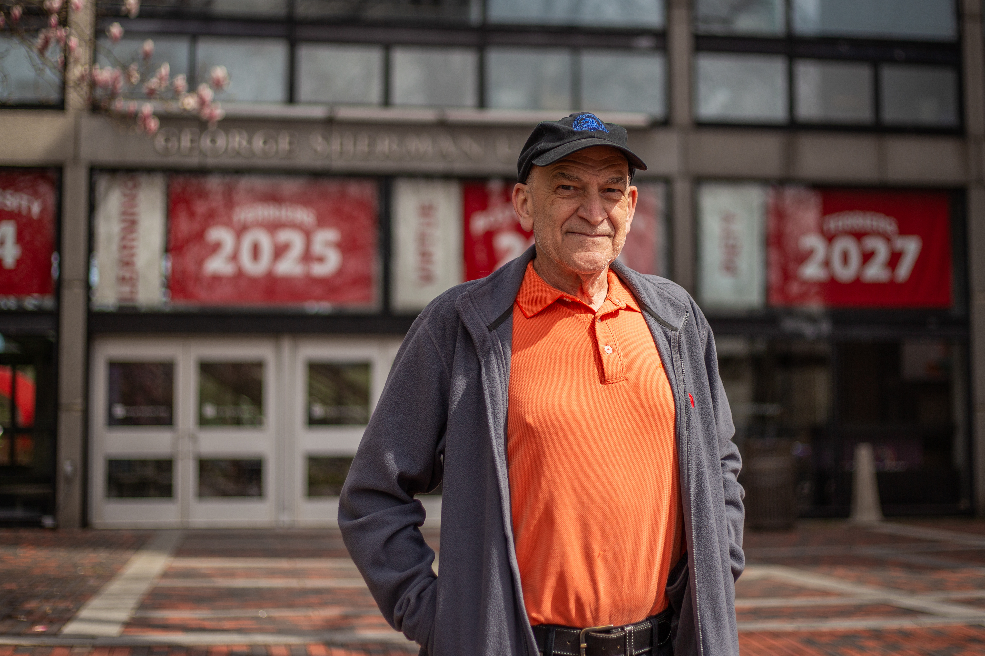 Mike Casciere, 69, poses for a portrait in front of Boston University's George Sherman Union. Casciere ran the 2024 Boston Marathon exactly 50 years to the day of his first Boston Marathon as a student at BU.
