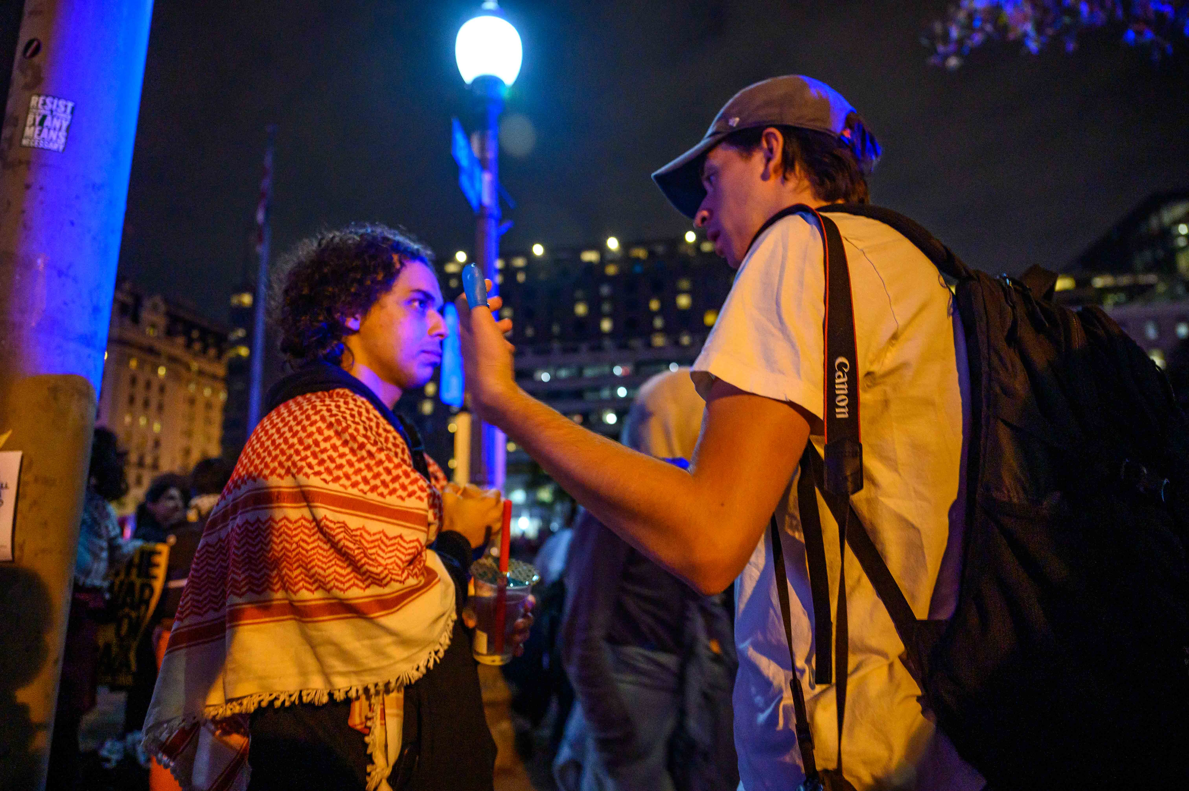 Matthew speaking to a protester in Washington about a protest. Photo by Taylor Coester.