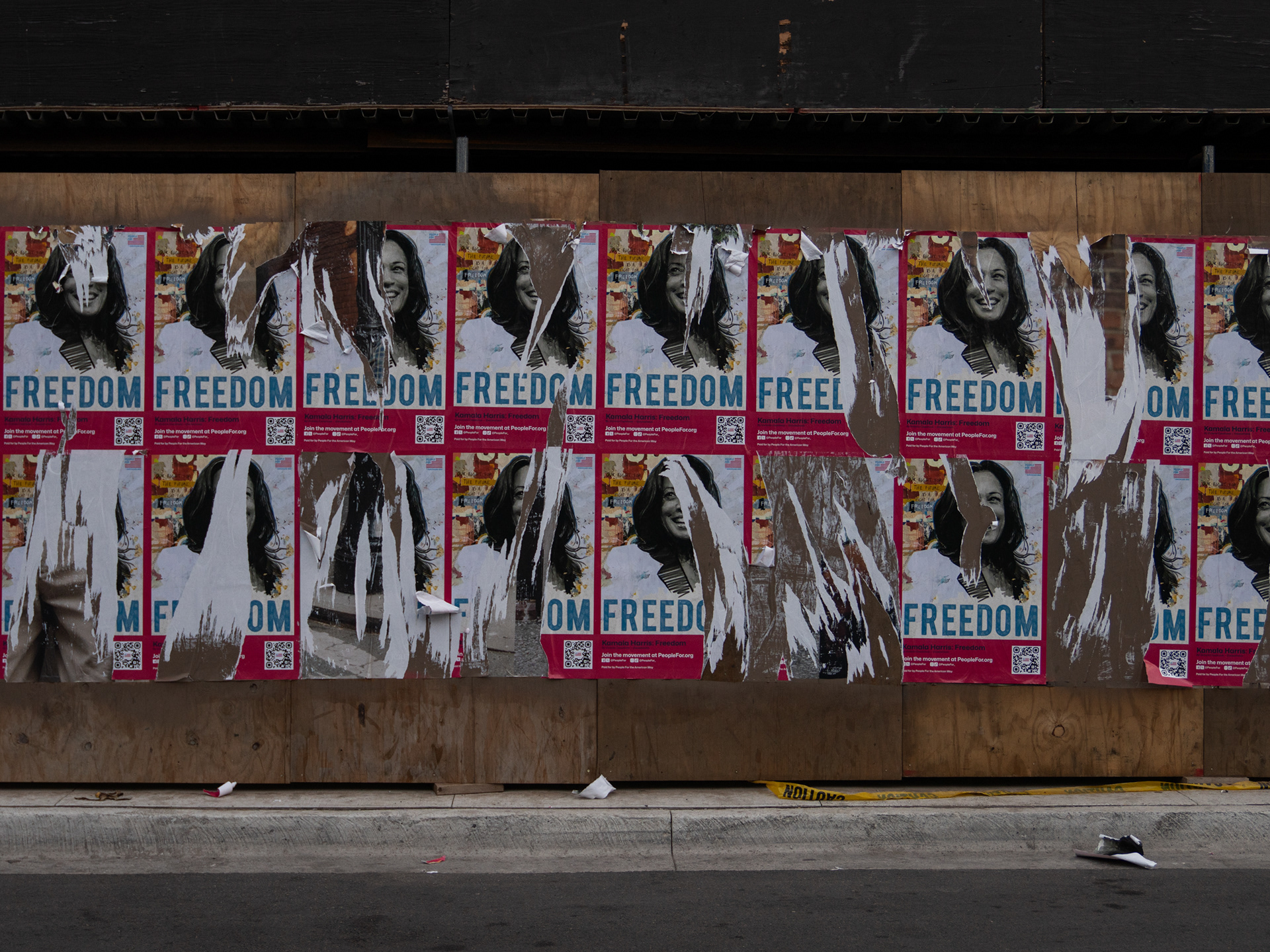 Chicago — Vice President Kamala Harris posters partially ripped down during a march on the DNC. Aug. 21, 2024.