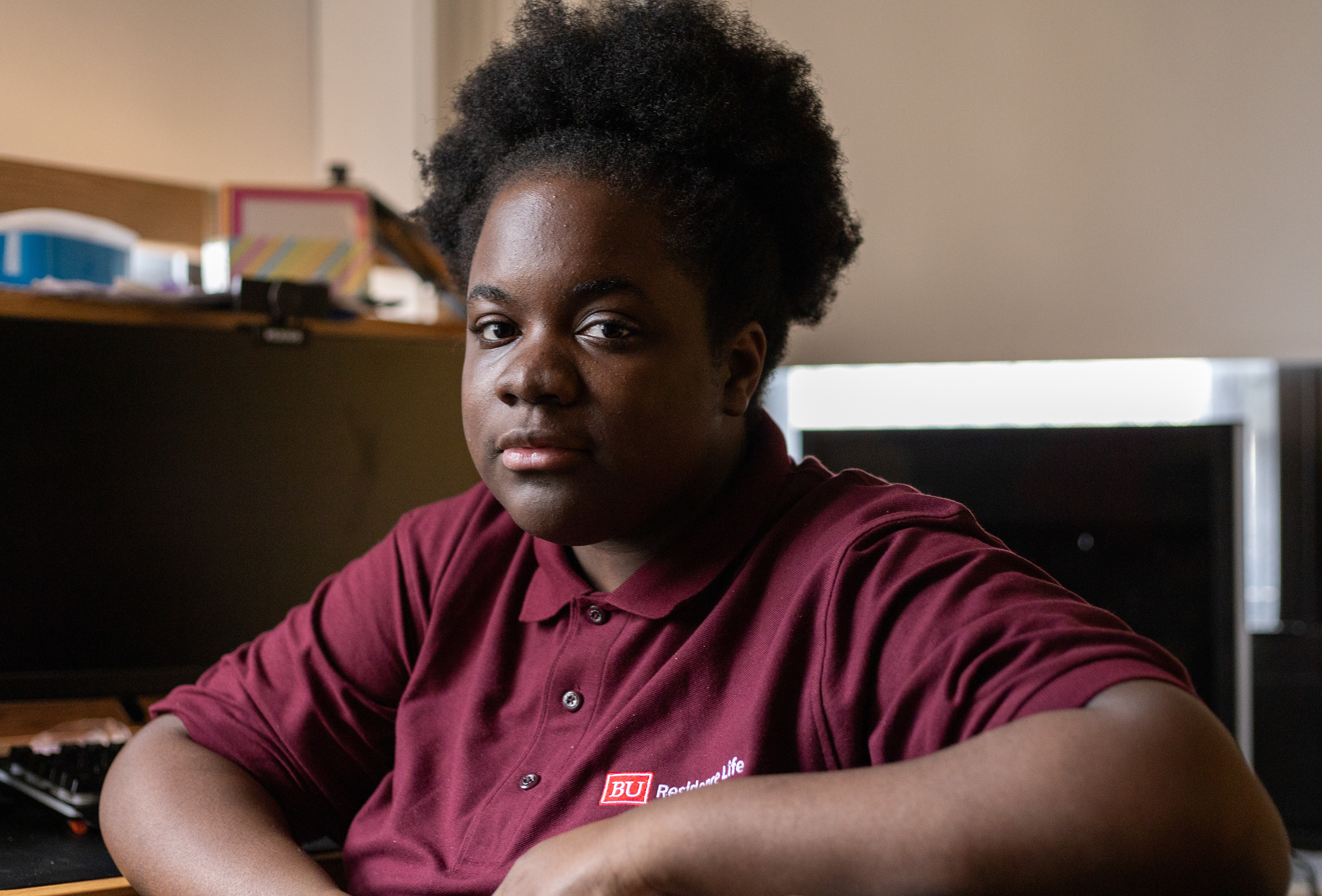 Guensly Desir, a senior at Boston University and resident assistant for BU housing, poses for a portrait in her dorm in March, 2024. Desir was removed from her position just days before the start of the fall 2023 semester due to a long-standing GPA policy enforced by BU housing.
