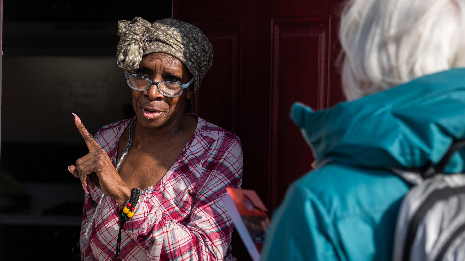 A Milwaukee voter speaks to Elizabeth Douglass, a Harris for President volunteer. Nov. 1, 2024.