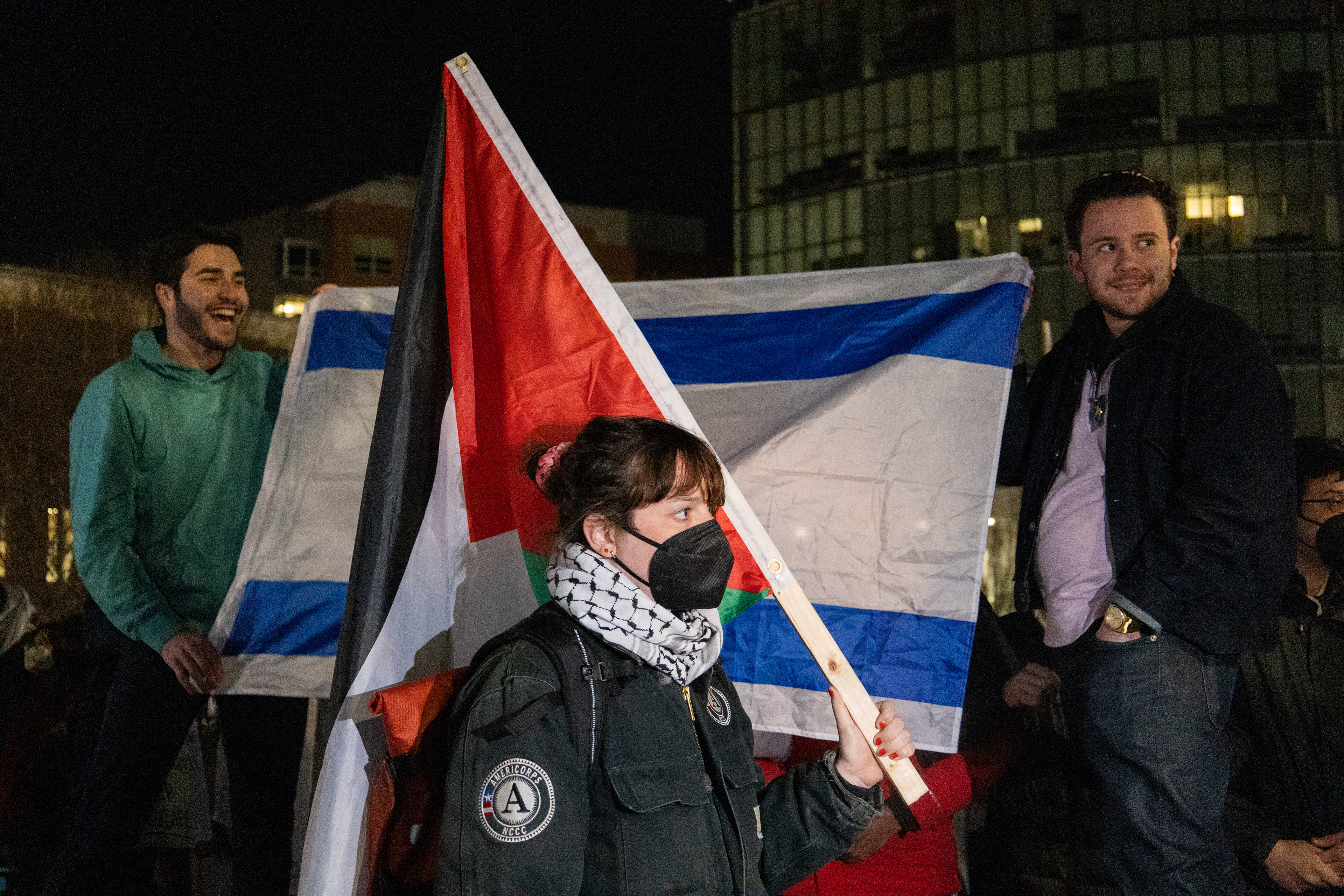 Boston — Protesters and counter-protesters stand against each other at Northeastern University's pro-Palestine encampment.