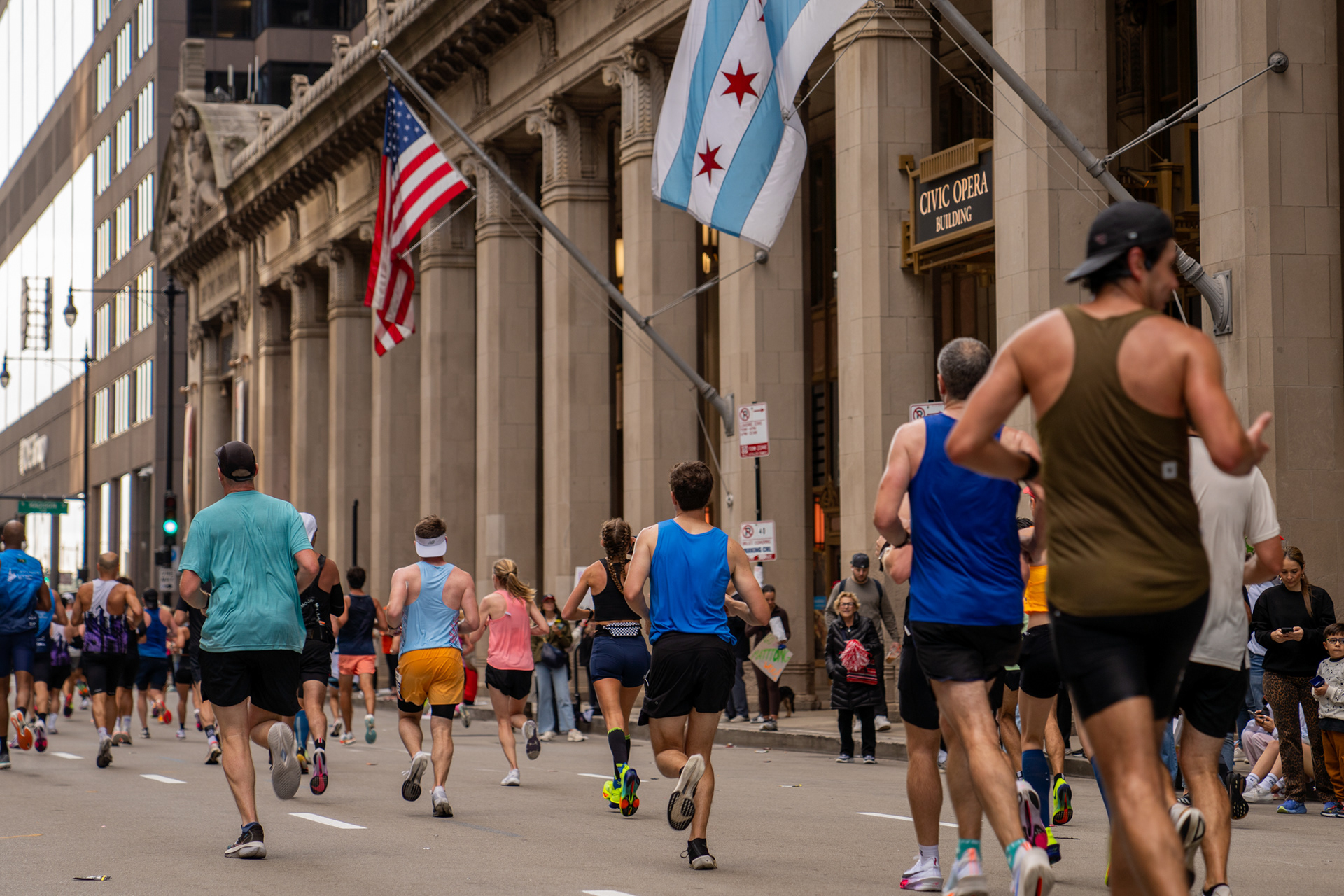 Chicago Marathon runners pass the Civic Opera House on Wacker Drive, just pass the 13.1 mile mark. Oct. 13, 2024.