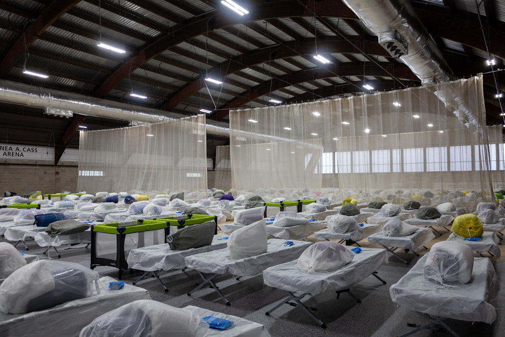 Boston — Melena Cass Recreation Center in Roxbury, Mass. lined with beds for hundreds of migrants after Massachusetts Gov. Maura Healey announced the center as a new migrant emergency housing facility.
