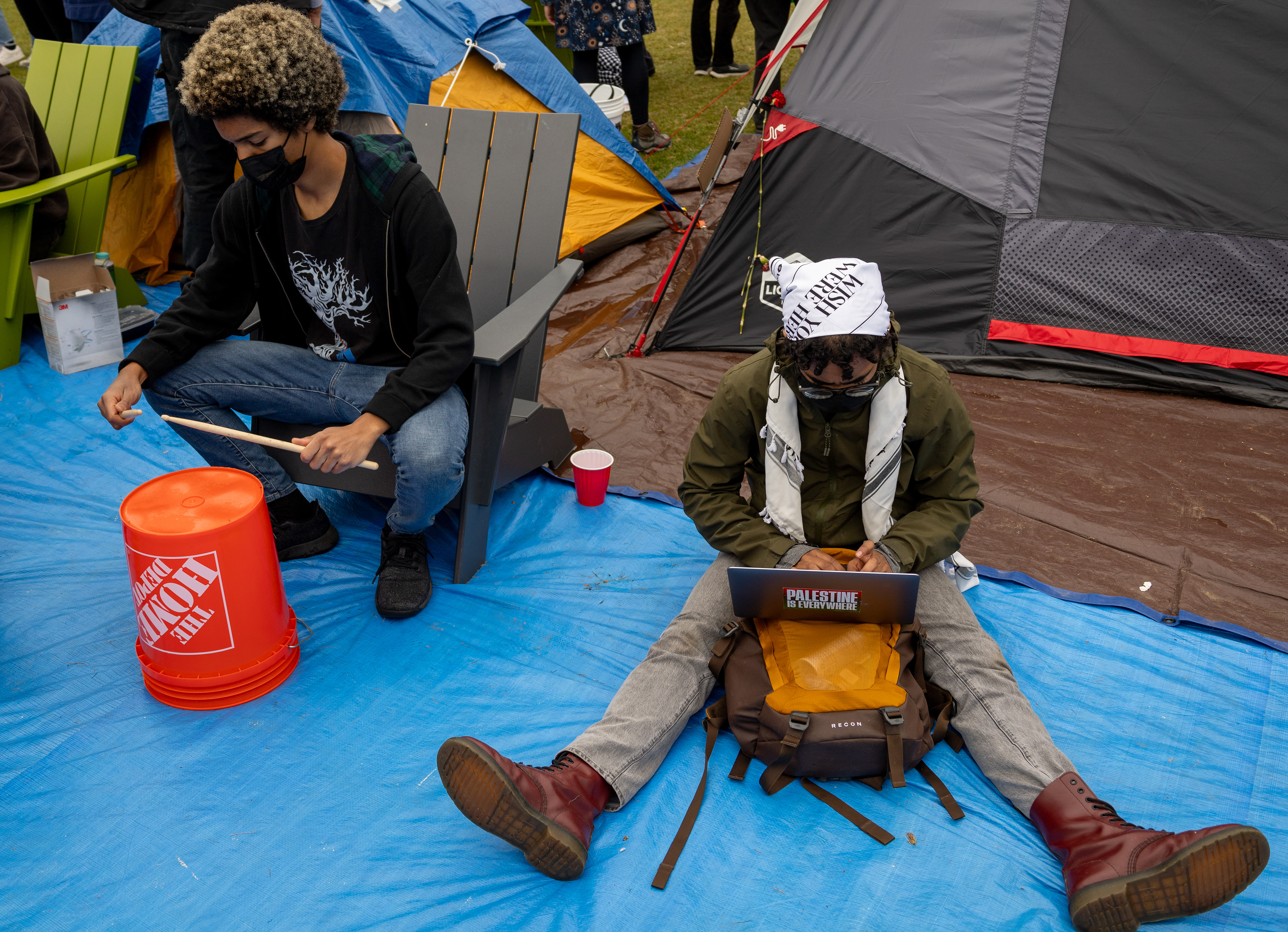 Camrbidge, Mass. — Protesters pass time by playing the drums and doing homework at M.I.T.'s pro-Palestine encampment.