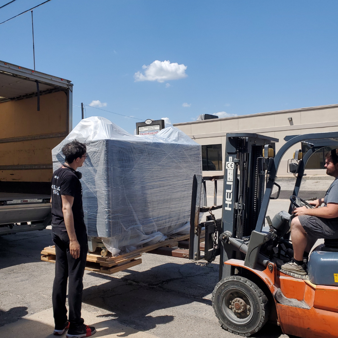 Loading an HP product onto a truck to ship to a customer