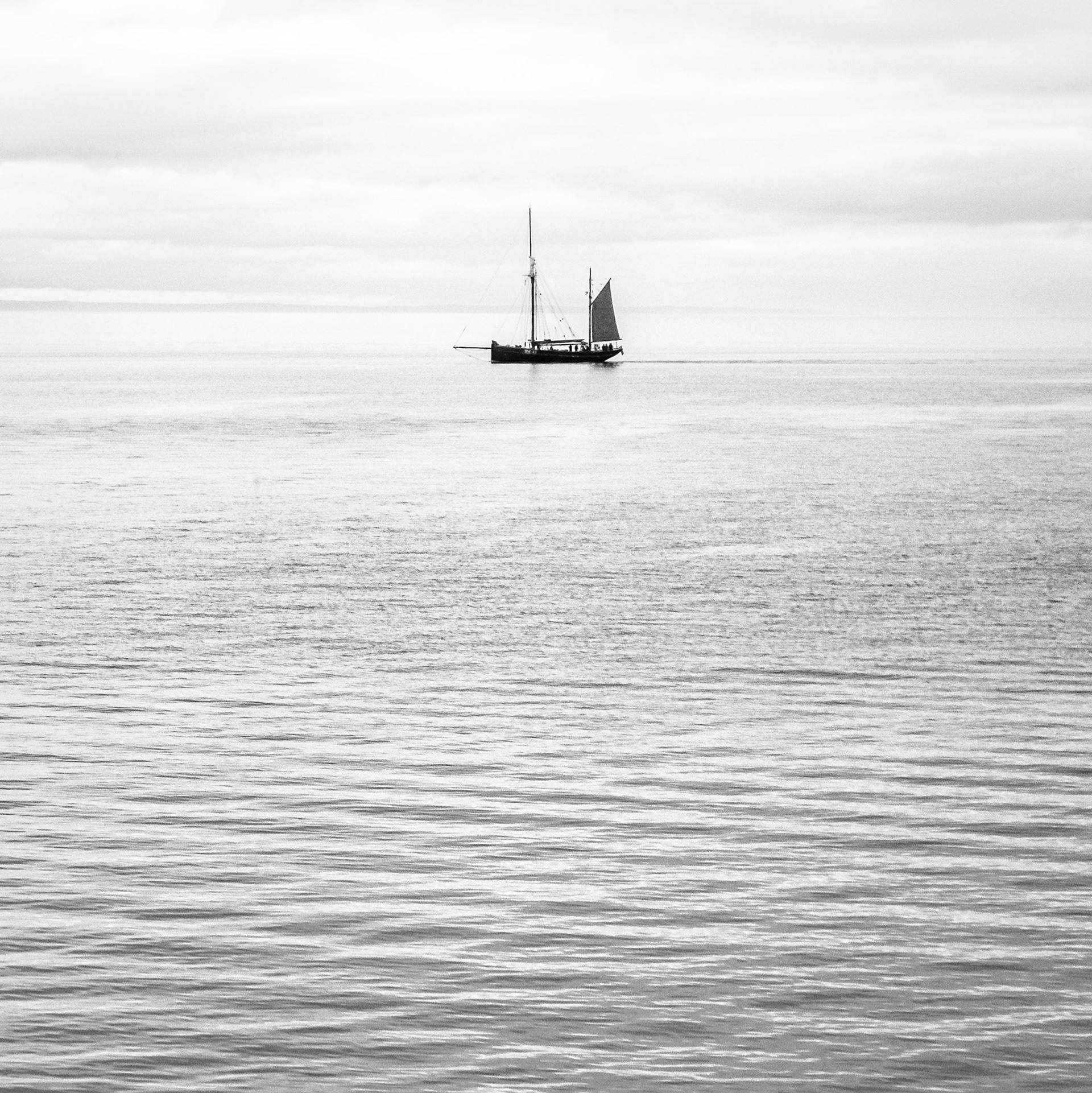 Its late in the day and this fishing boat returns to Brixham in Devon, hopefully having enjoyed a successful days fishing.