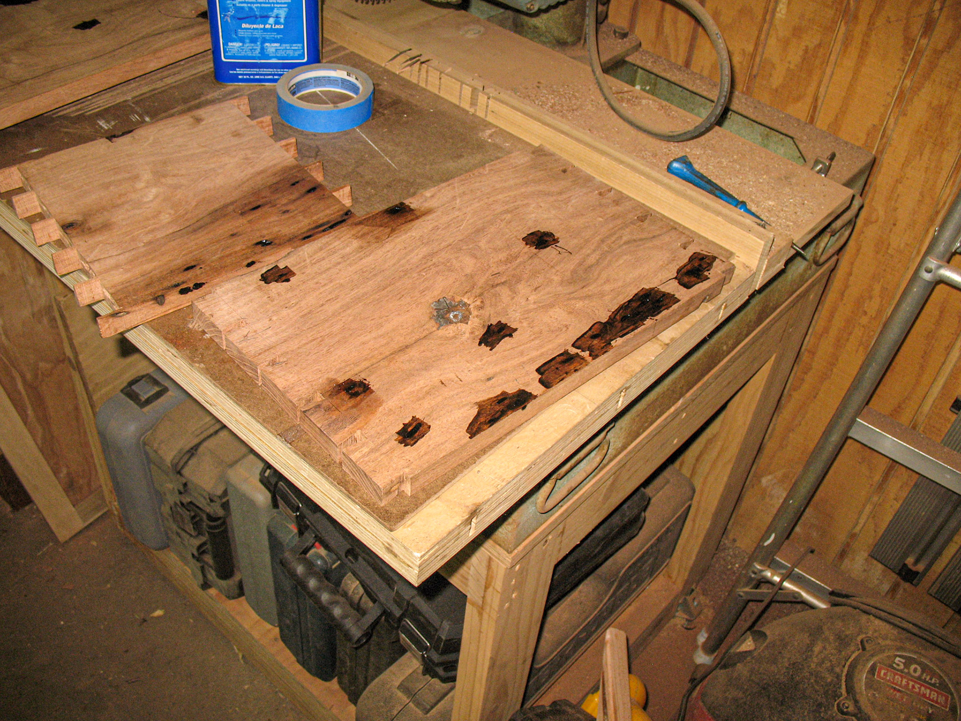 Filling the bug holes with black-tinted epoxy