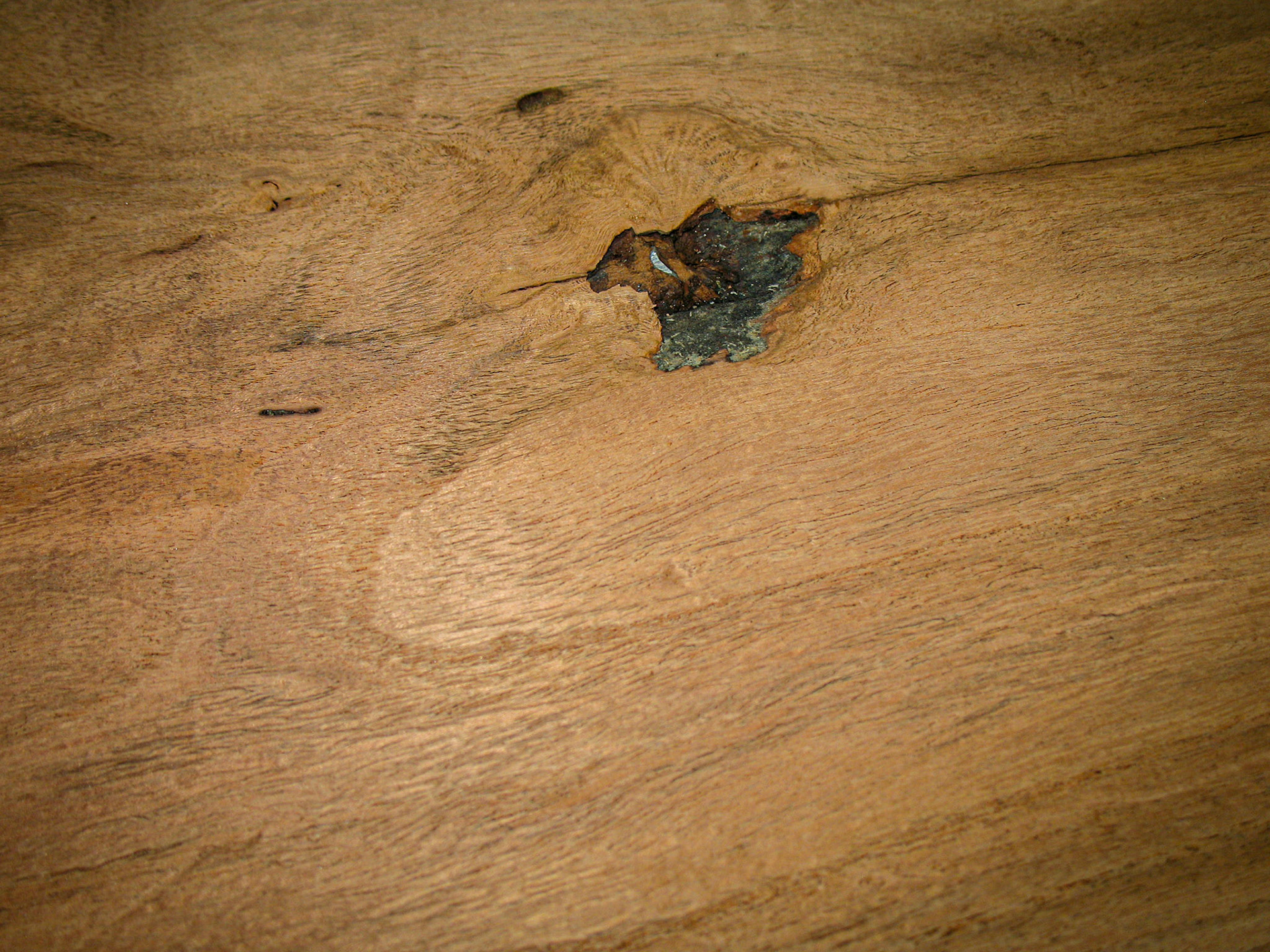 Something you don't want to see on a board as it exits your planer:  the sheen of fresh-cut metal.