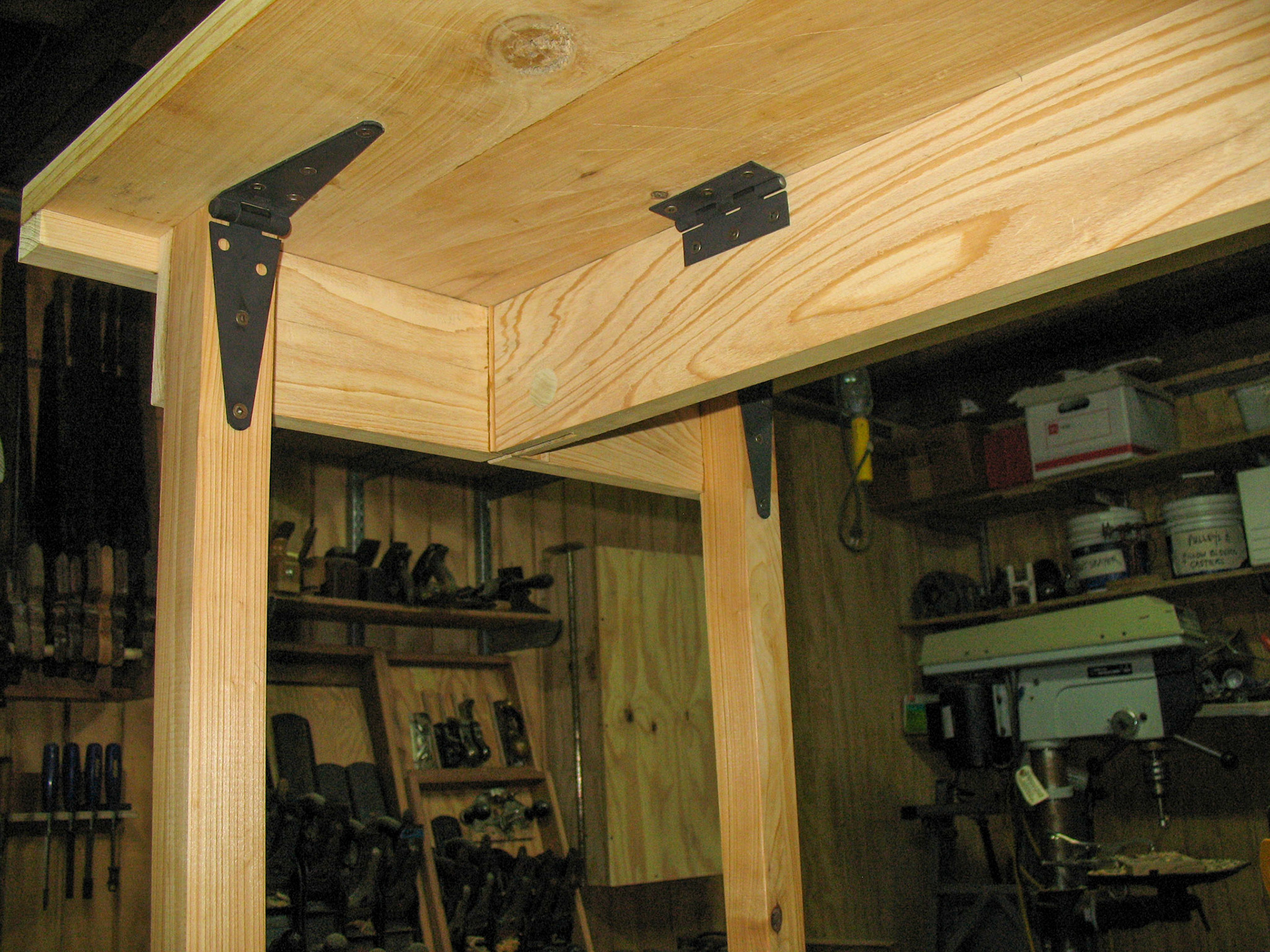 Underneath, showing the refinished hinges