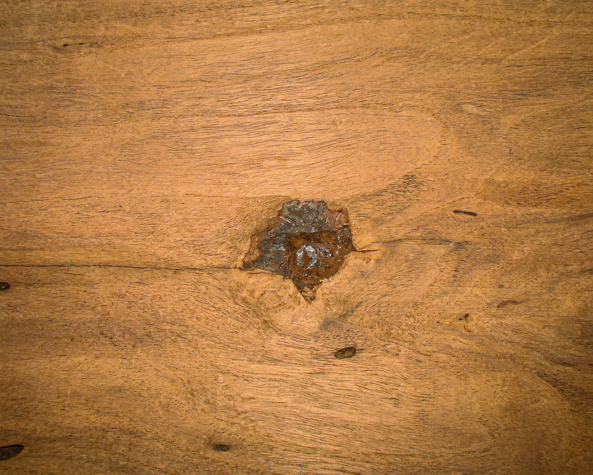 It is hard to tell from this picture, but that is a bullet stuck in the mesquite board.