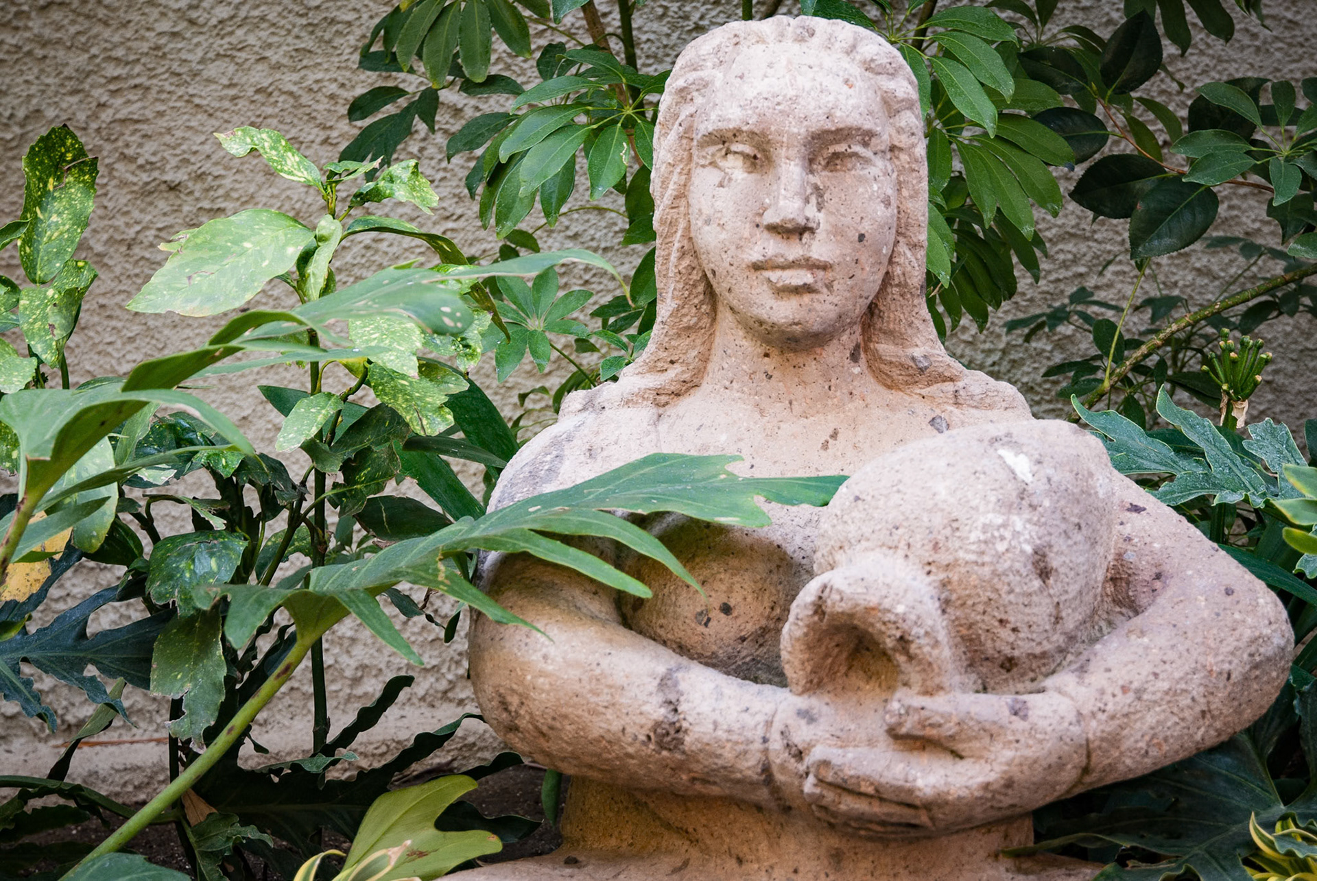 Statue of lady with vessel