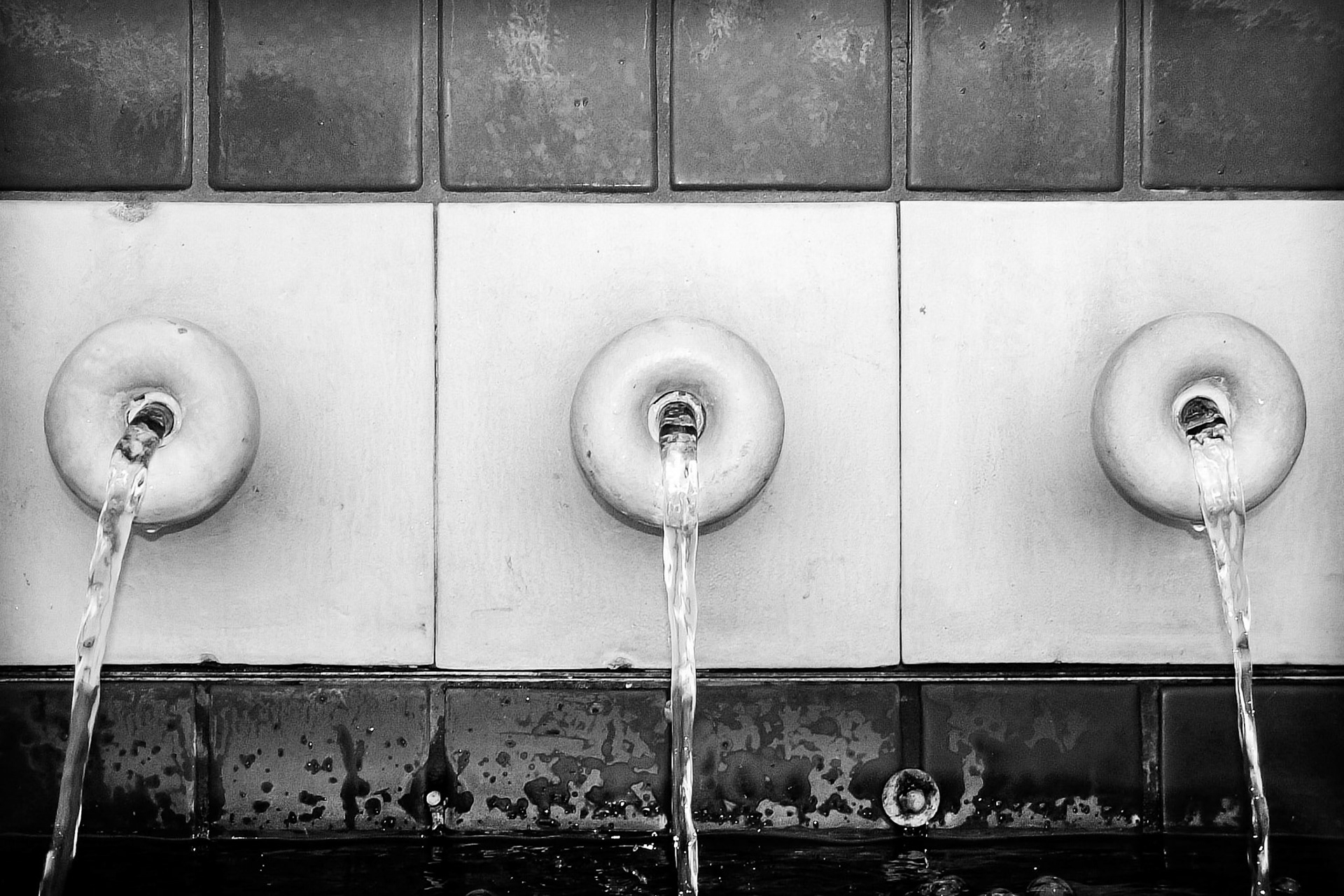 These are three of the many cascading features of a small pool and fountain in Miami