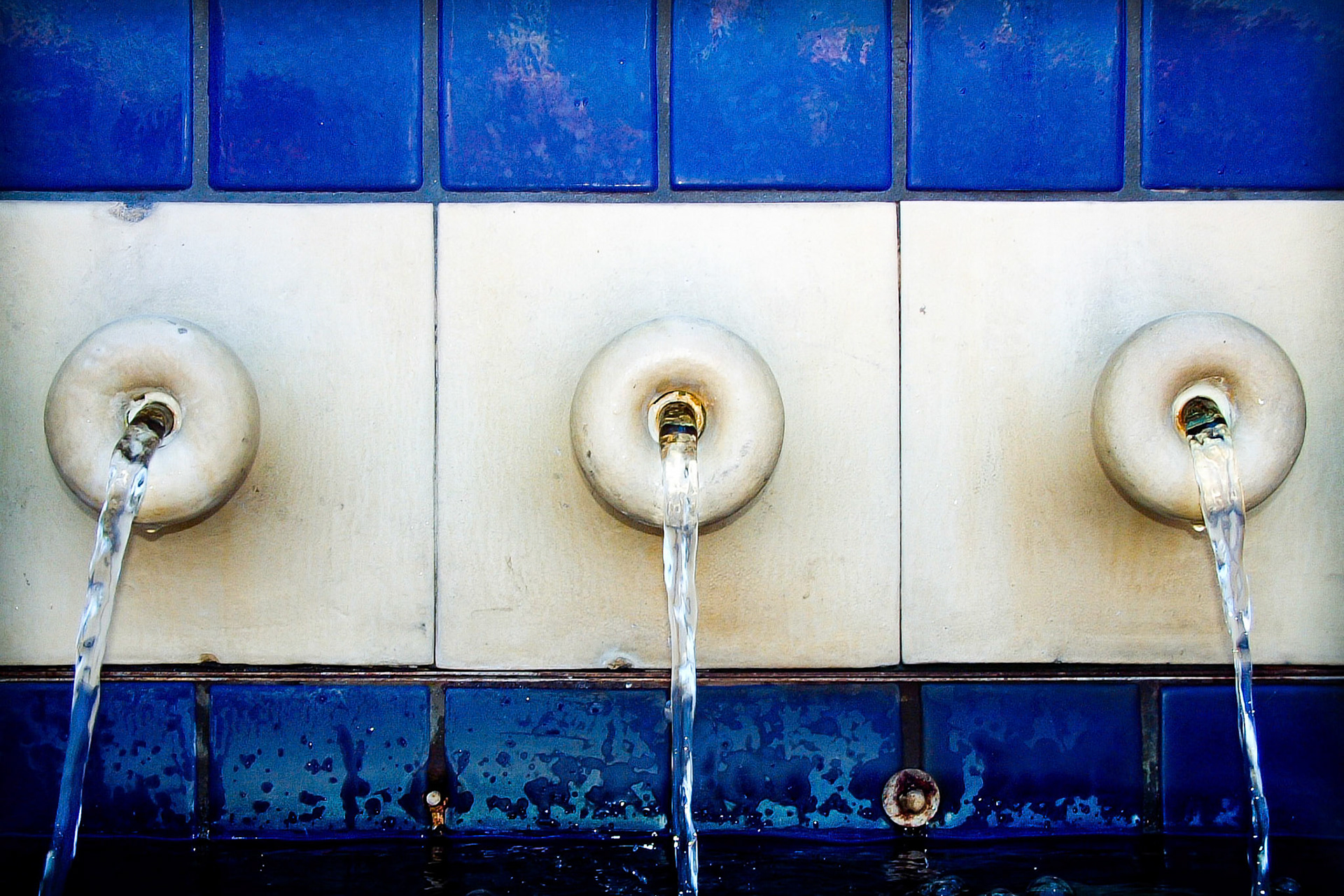 These are three of the many cascading features of a small pool and fountain in Miami