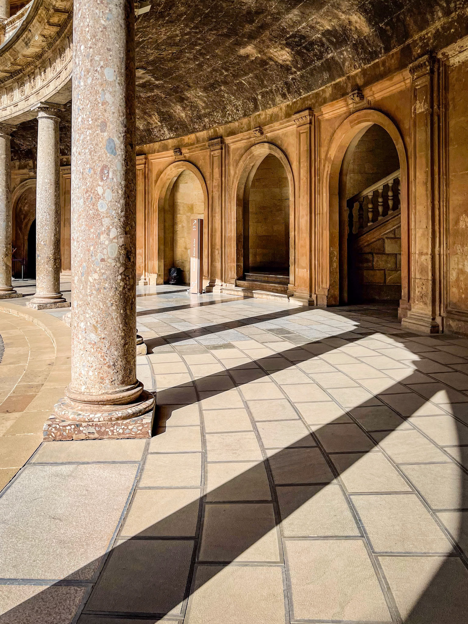 Place of Charles V at Alhambra with columns and shadows