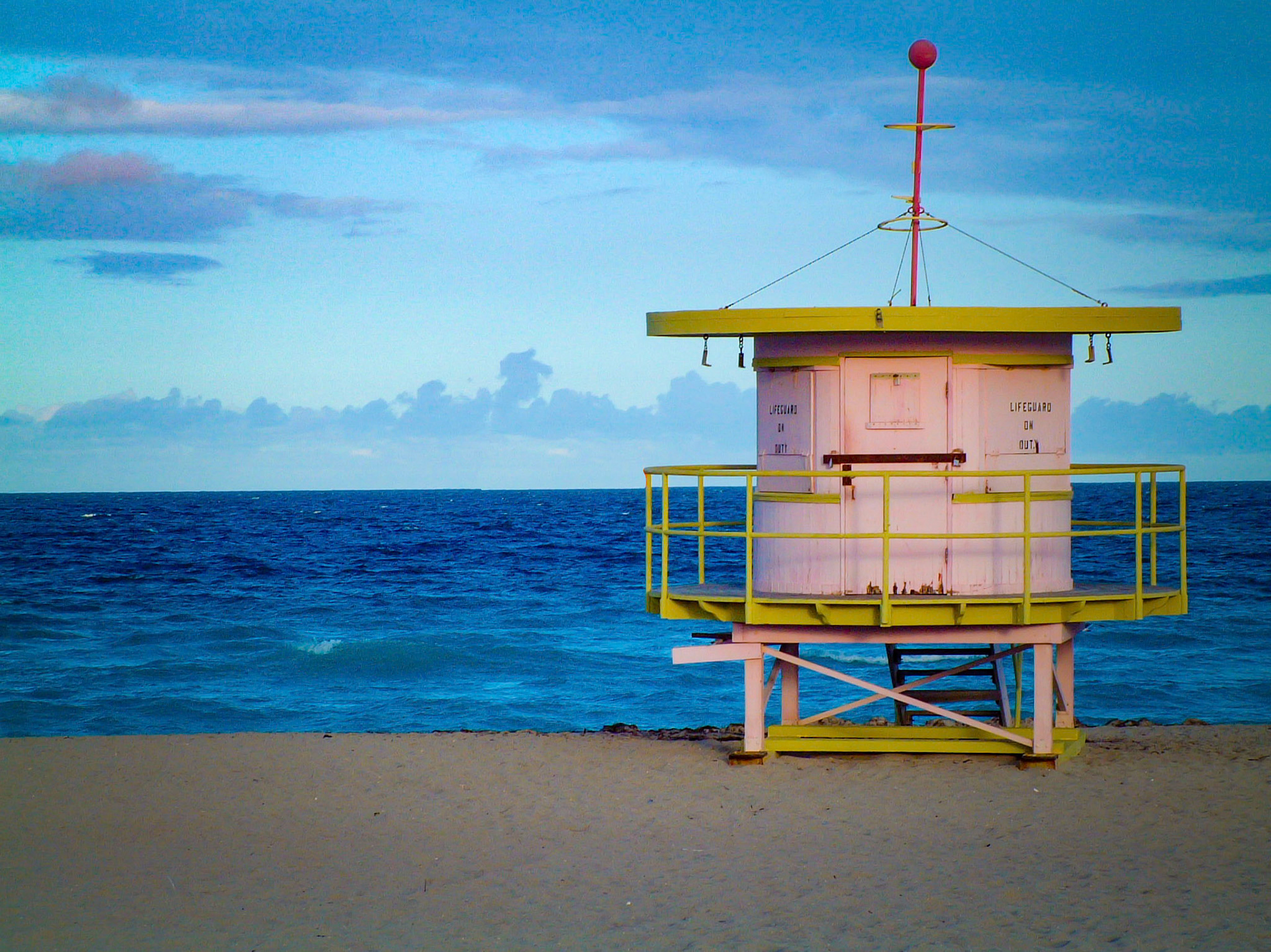 Late afternoon, walking the beach in Miami. The lifeguard stations are pretty colorful.
