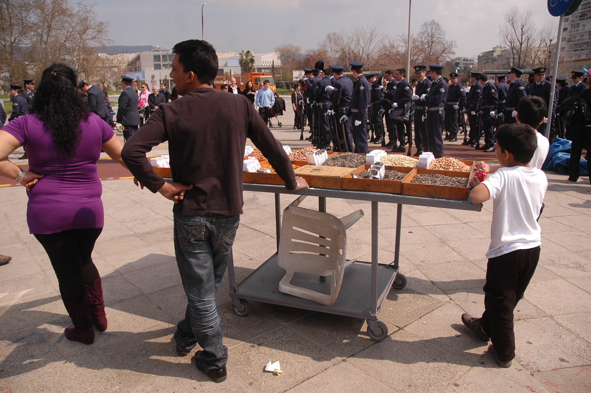 Photo from the 'Classic White' project, showcasing the utility of the white plastic monobloc chair in everyday street scenes.