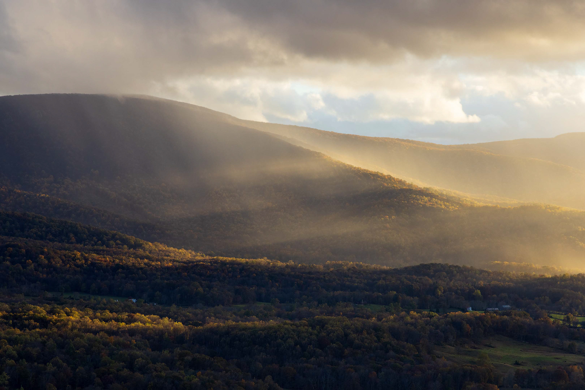 Sun beams through Rain Clouds