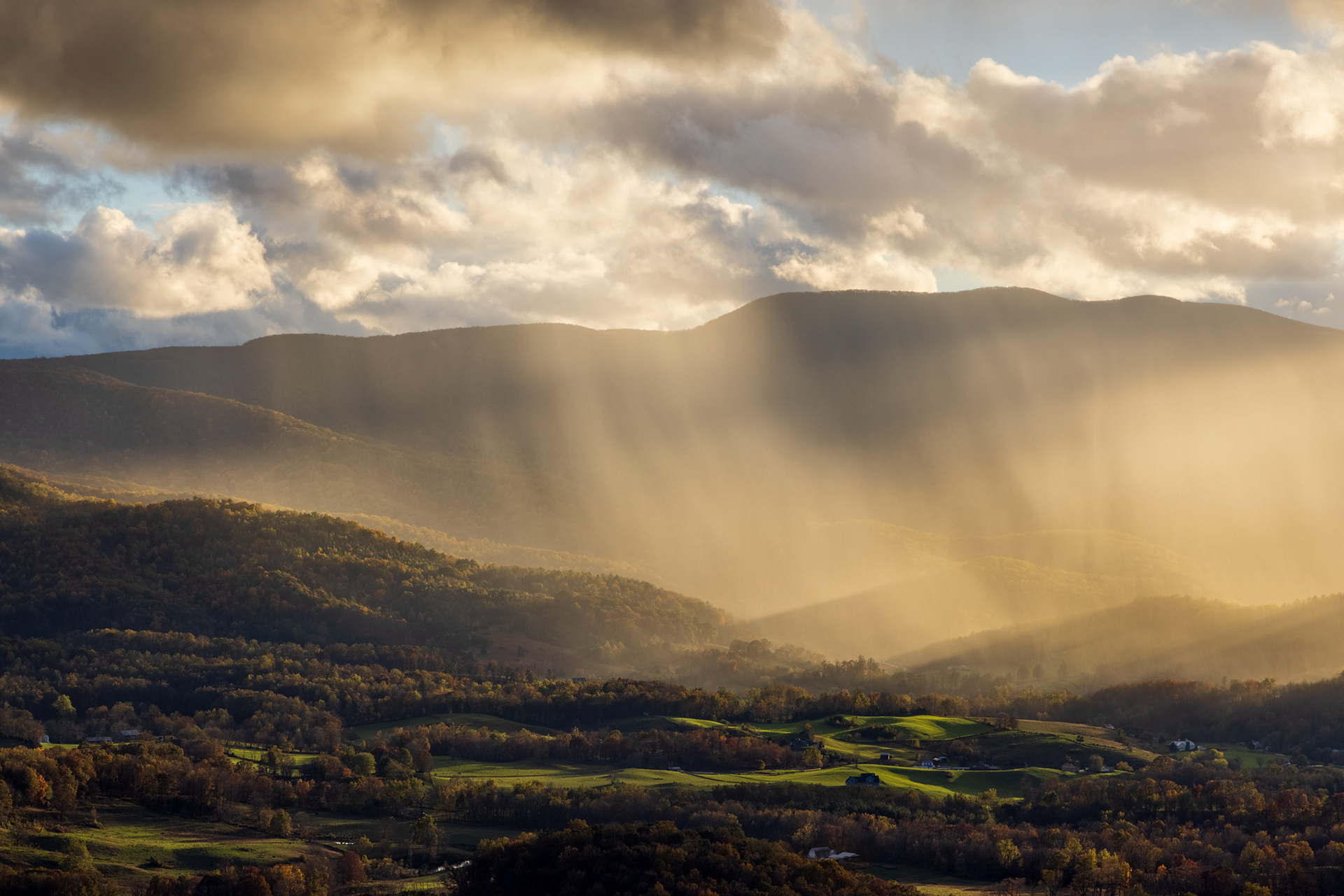 Sun beams through Rain Clouds