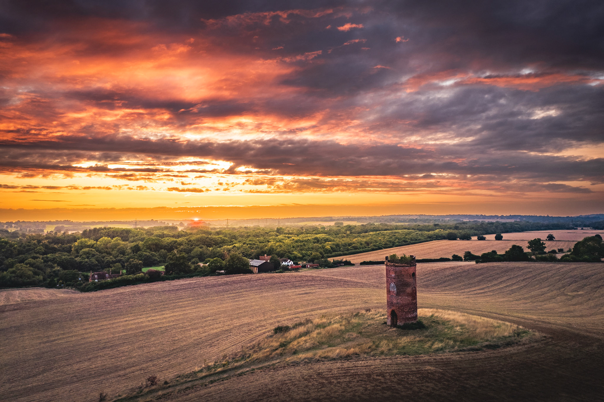 Wilders Folly in Berkshire, near Reading, UK. Taken from drone with a magical bright red sunset