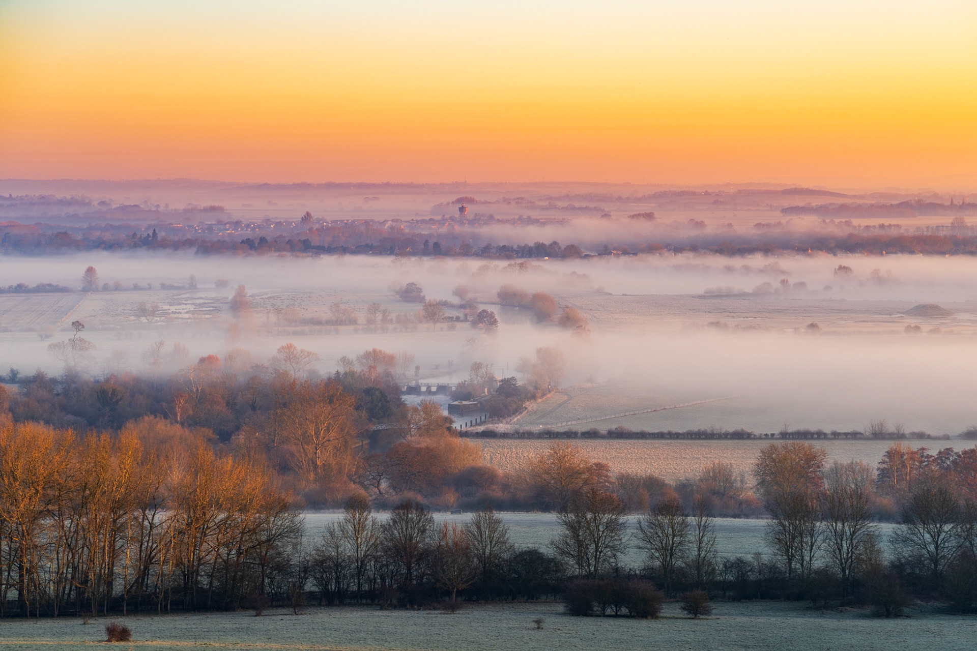 A truly magical sunrise over Oxfordshire, where low mist creates depth in this colourful scene.