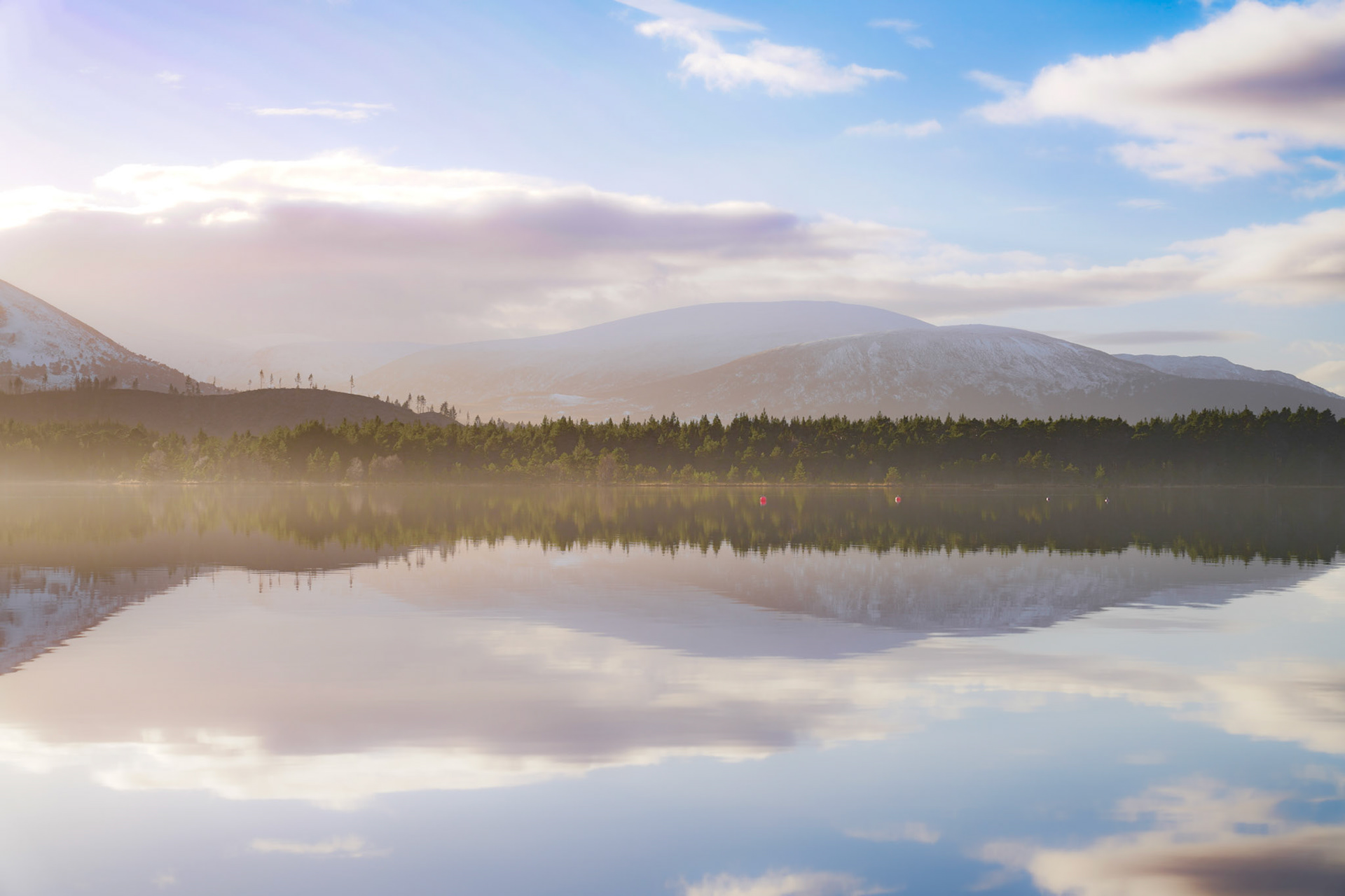 Beautiful reflections on this simple landscape on Loch Morlich, Scotland
