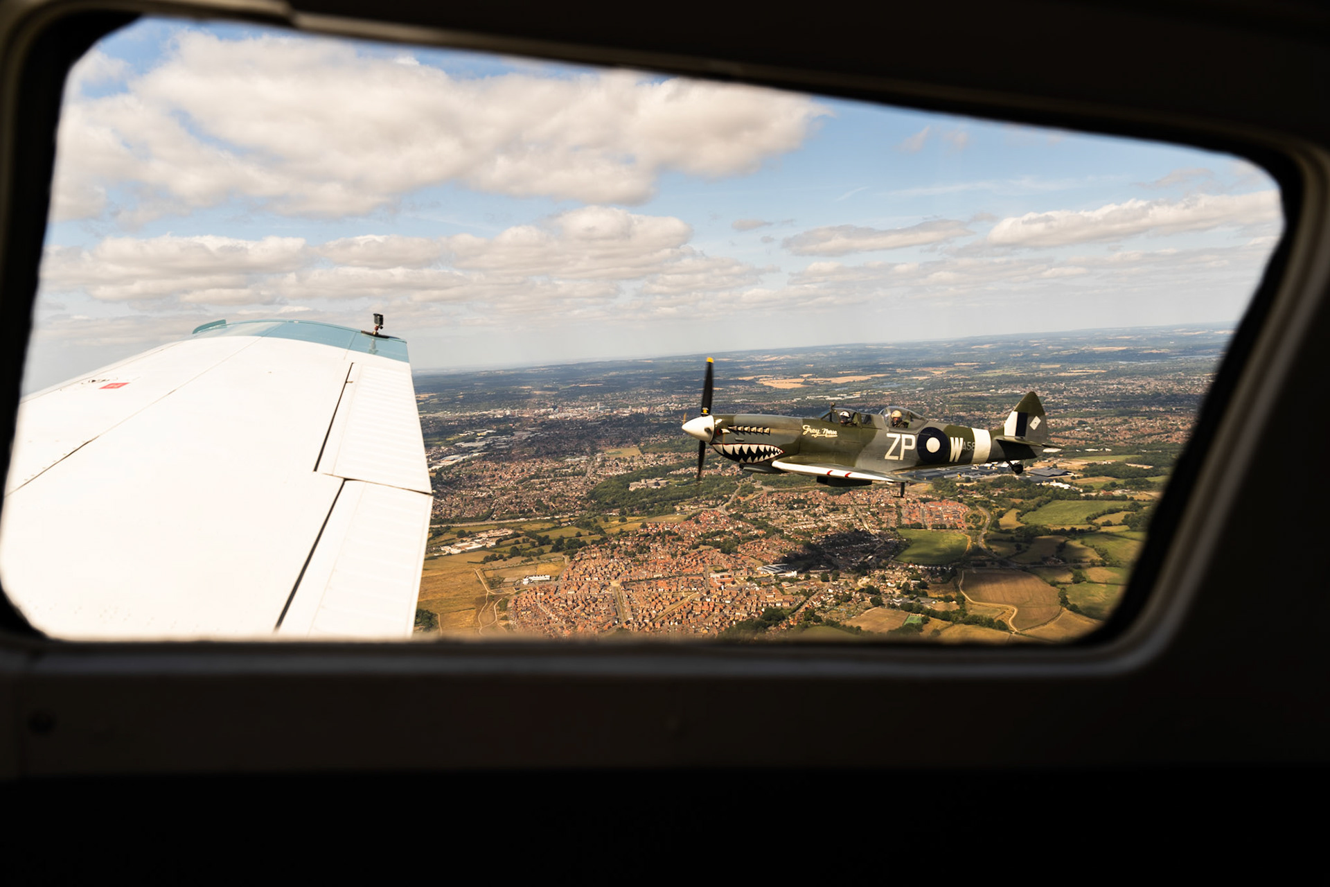 Spitfire from a formation aircraft window