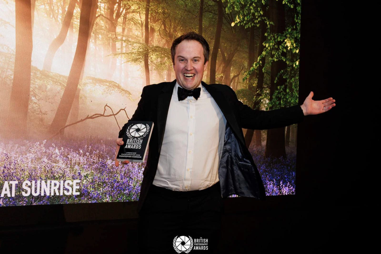 Christopher Harrison at the British Photography Awards in London, with his winning trophy from the Landscape Category where his image Bluebells at Sunrise won. 