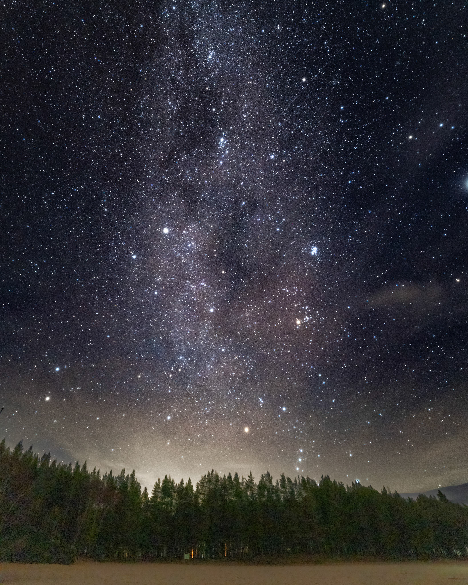 The Milky Way clearly visible with Andromeda from the beach of Loch Morlich, Cairngorms, Scotland