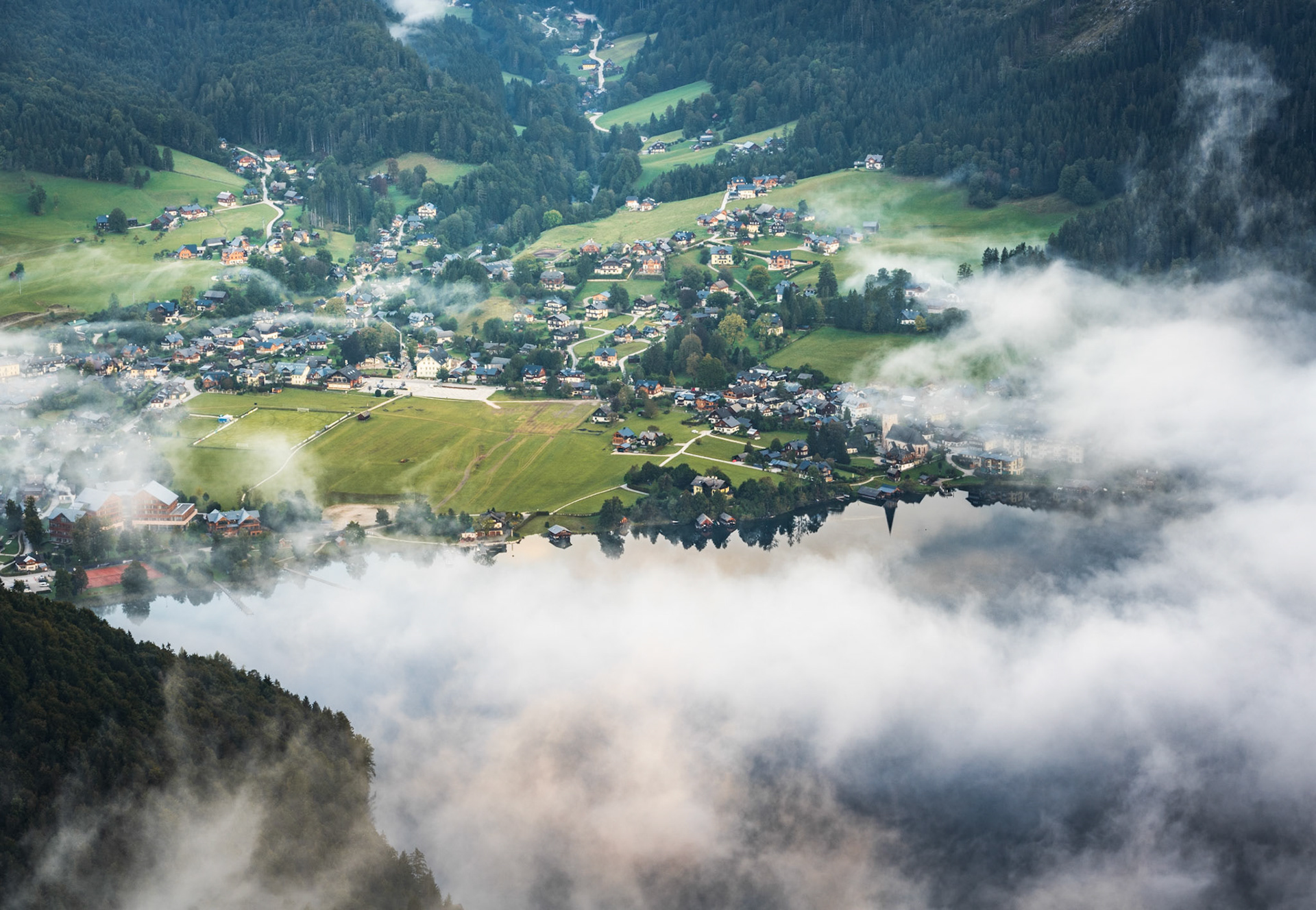 Down to Altausee from a local viewpoint during a still morning and cloud inversion, Austria