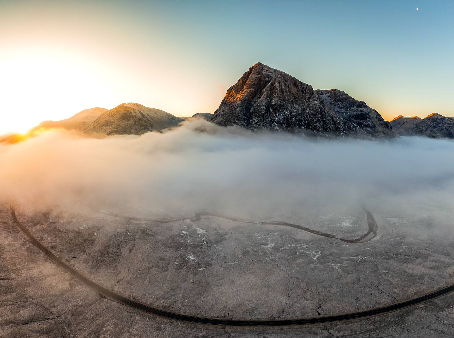 Above and Below the Cloud Inversion during Sunrise at the Buachaille Etive Mor in Glencoe, Scotland