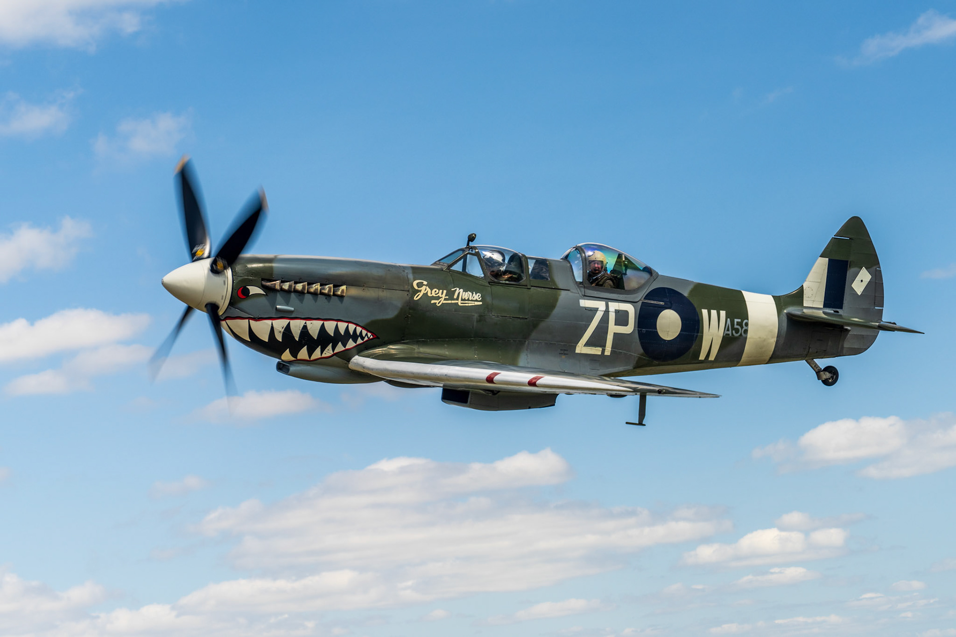 Spitfire in flight against beautiful blue skies.