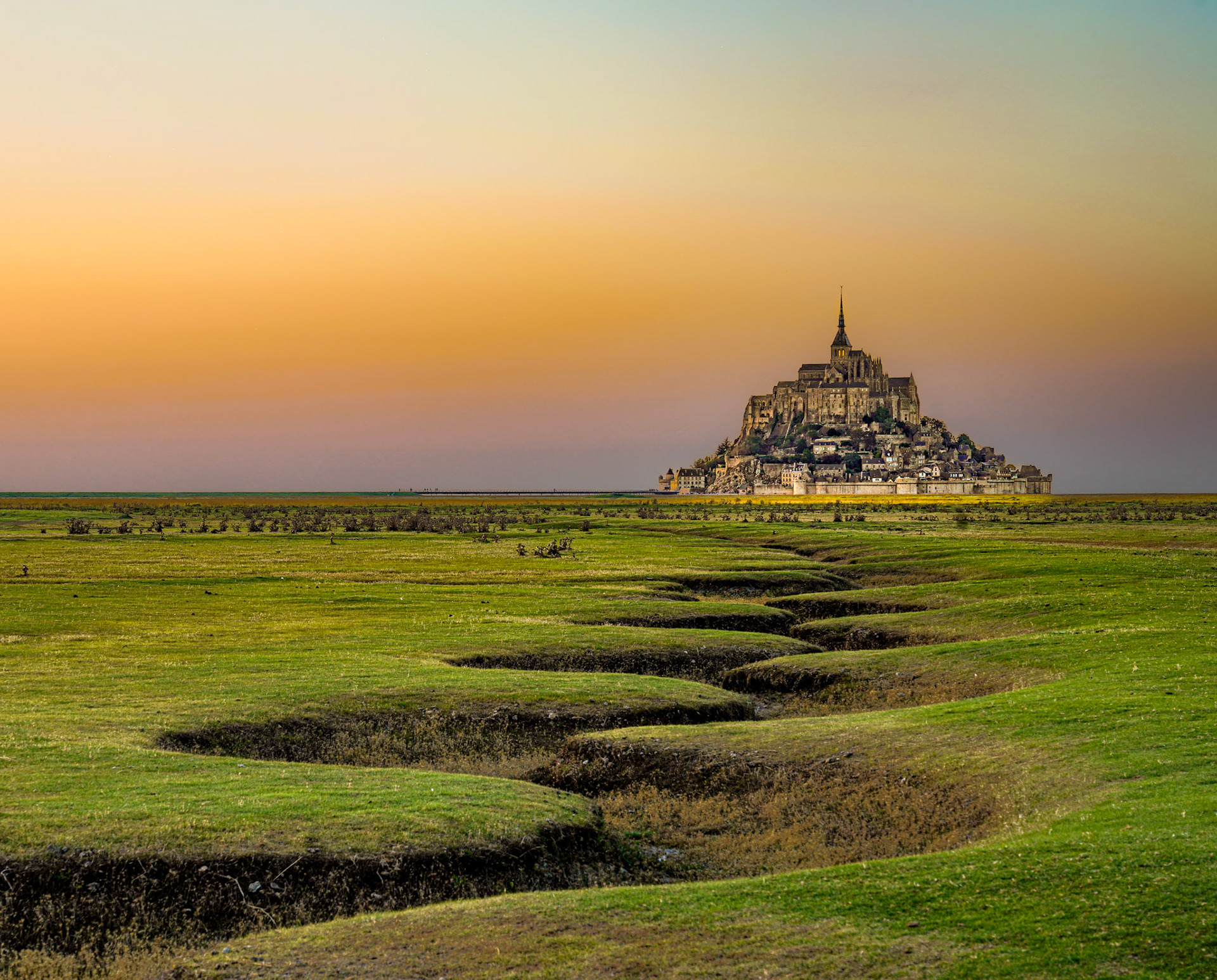 Mont Saint Michel seen from the Meanders, interesting patterns in the soft ground, Normandy, France