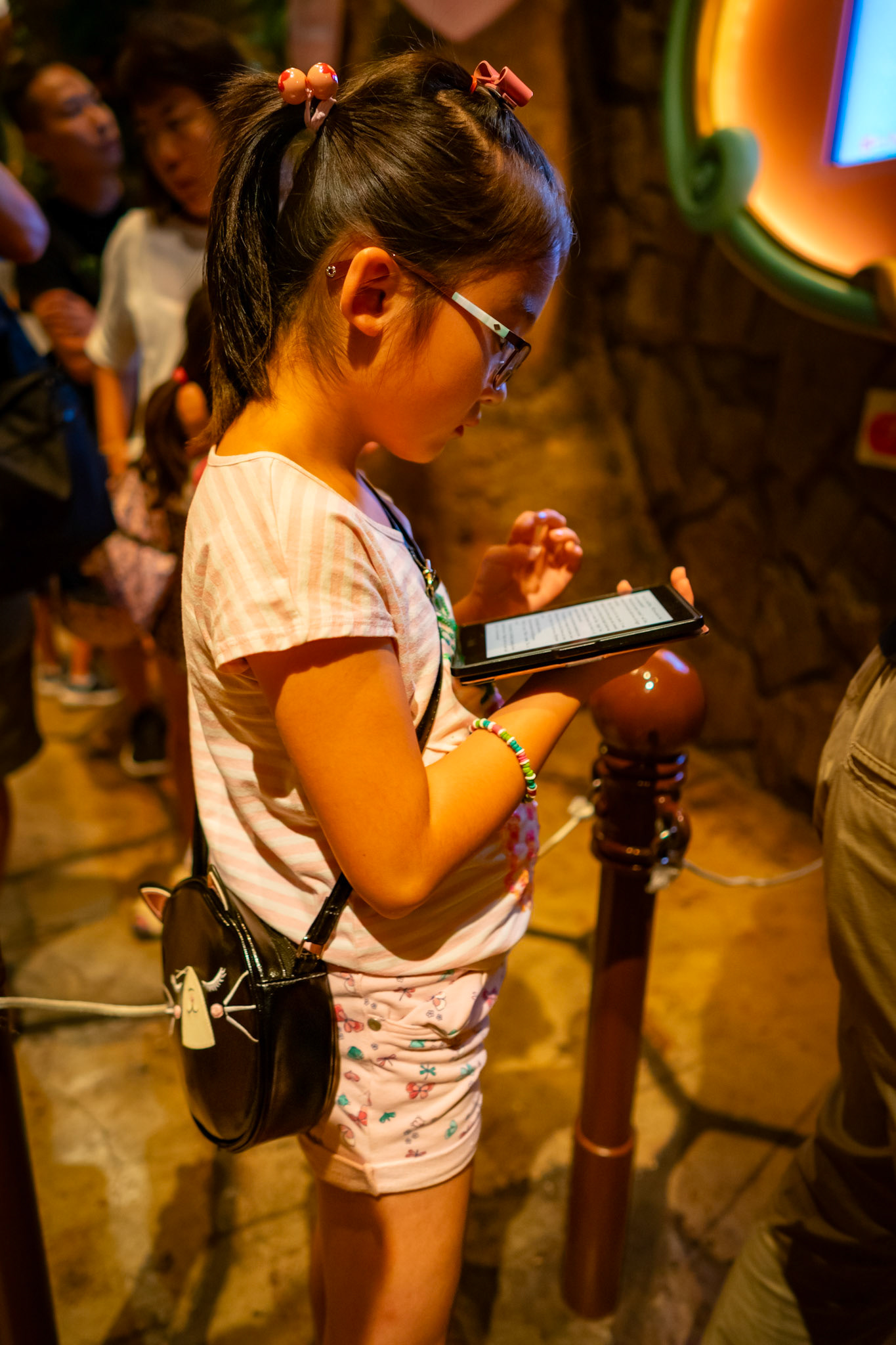My daughter is reading Harry Potter on her Kindle while we wait.