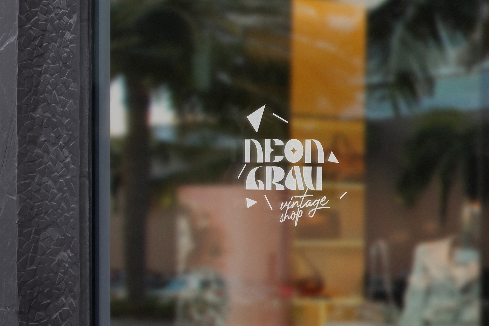 As a logo on the window front of the vintage shop