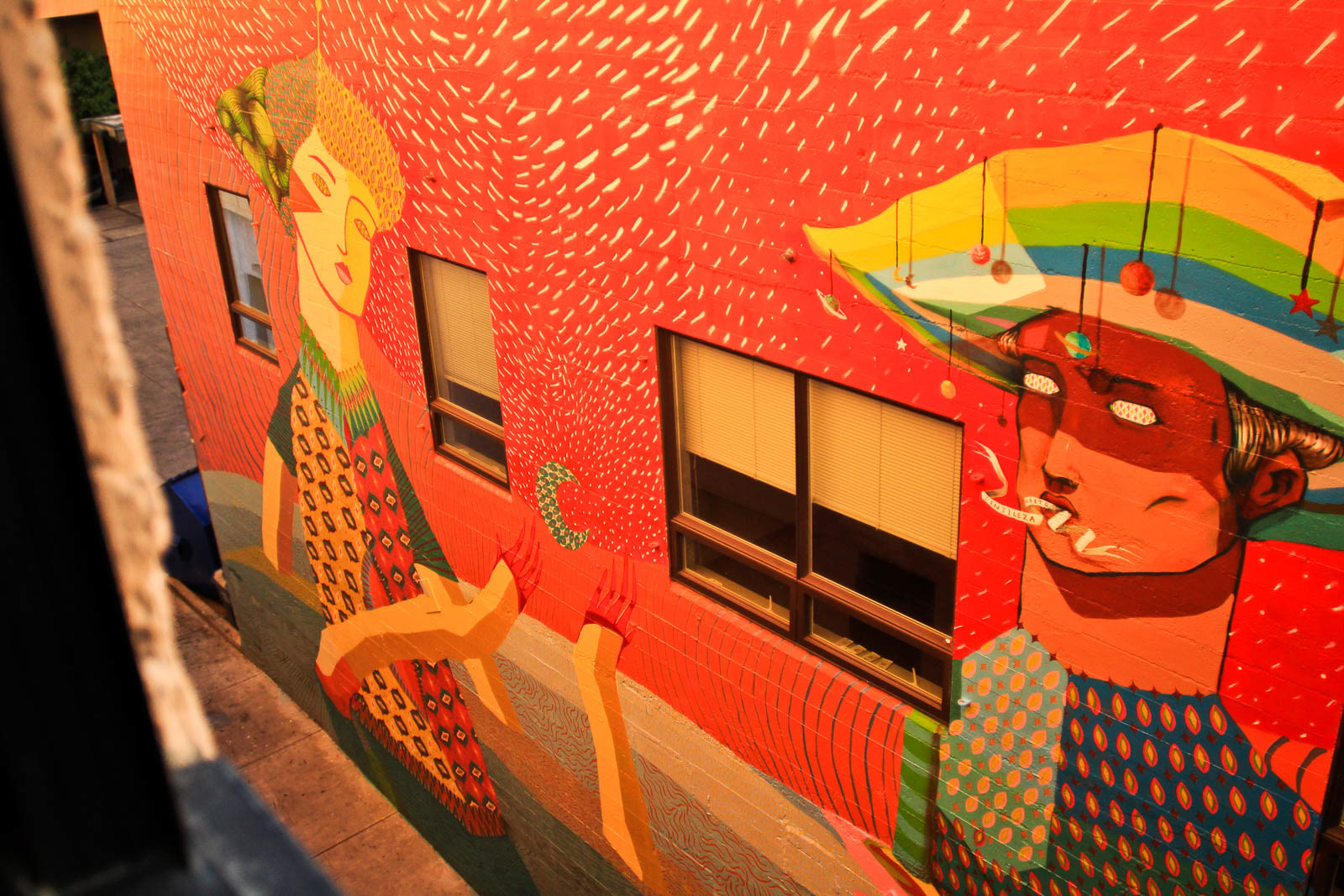 Colorful mural painting on alley wall in downtown Eugene