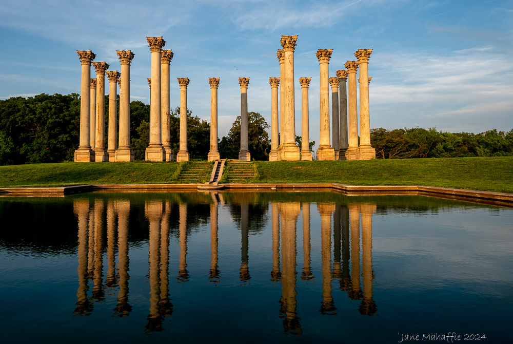 National Arboretum reflection in the setting sun May 2024